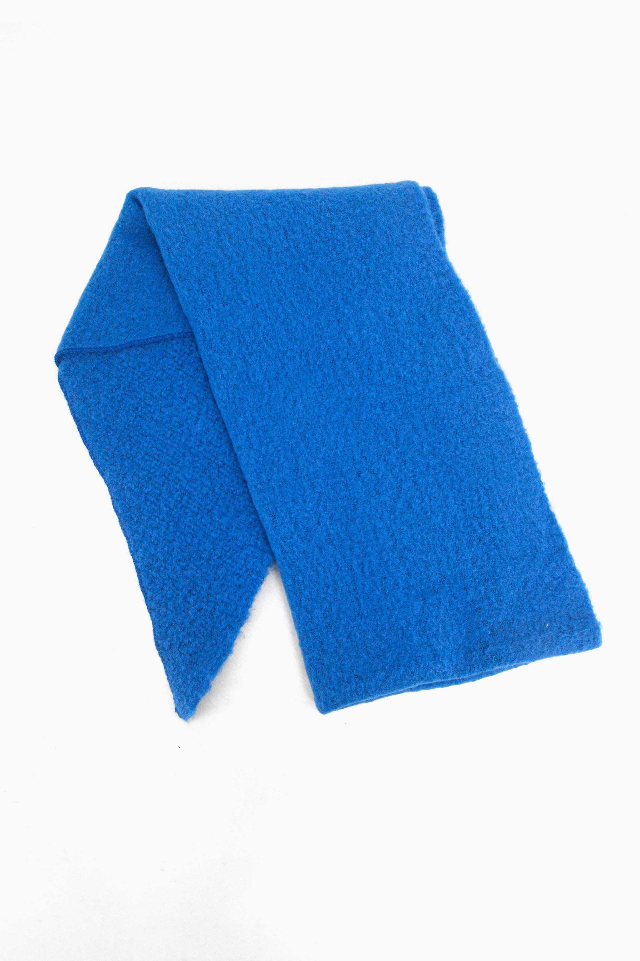 showing the scarf folded highlighting the solid plain royal blue colour