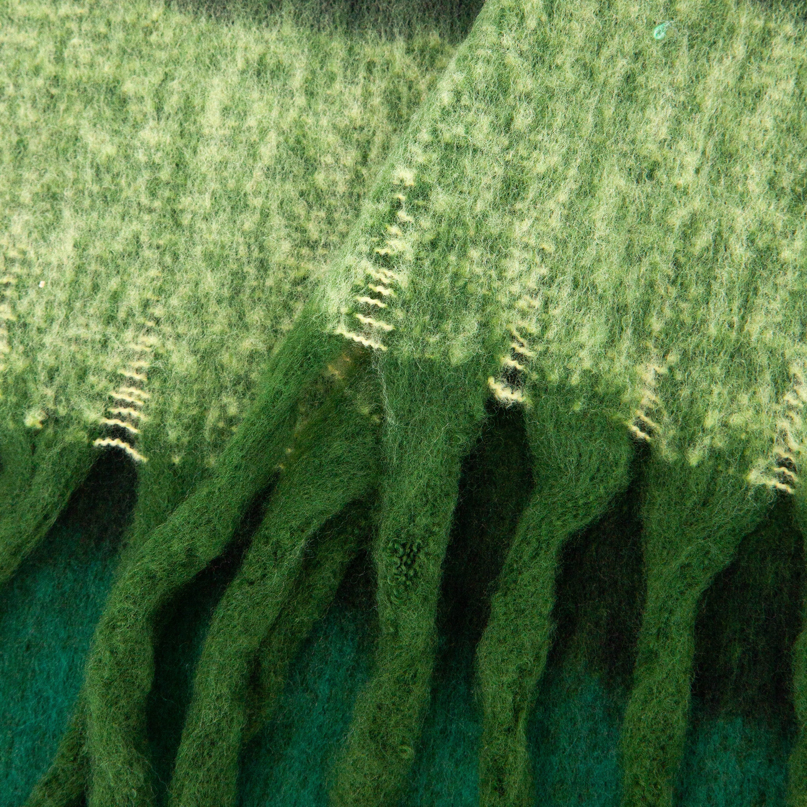 close up of the soft viscose knitted material of the winter blanket scarf