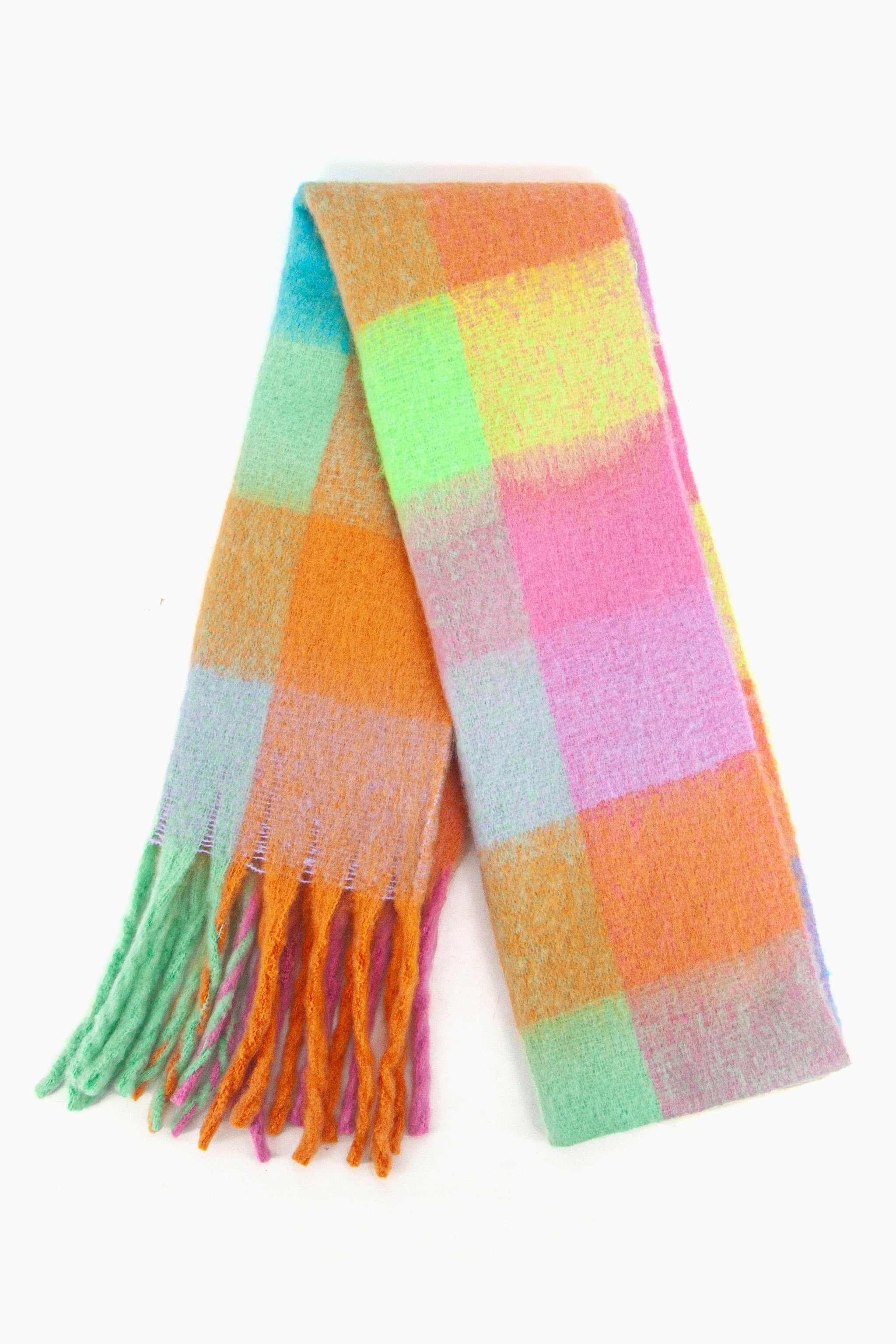 showing the scarf folded while laying flat, the multi colour square block pattern is highlighted. there are yellow, orange, green, pink and blue tones visible in the design.