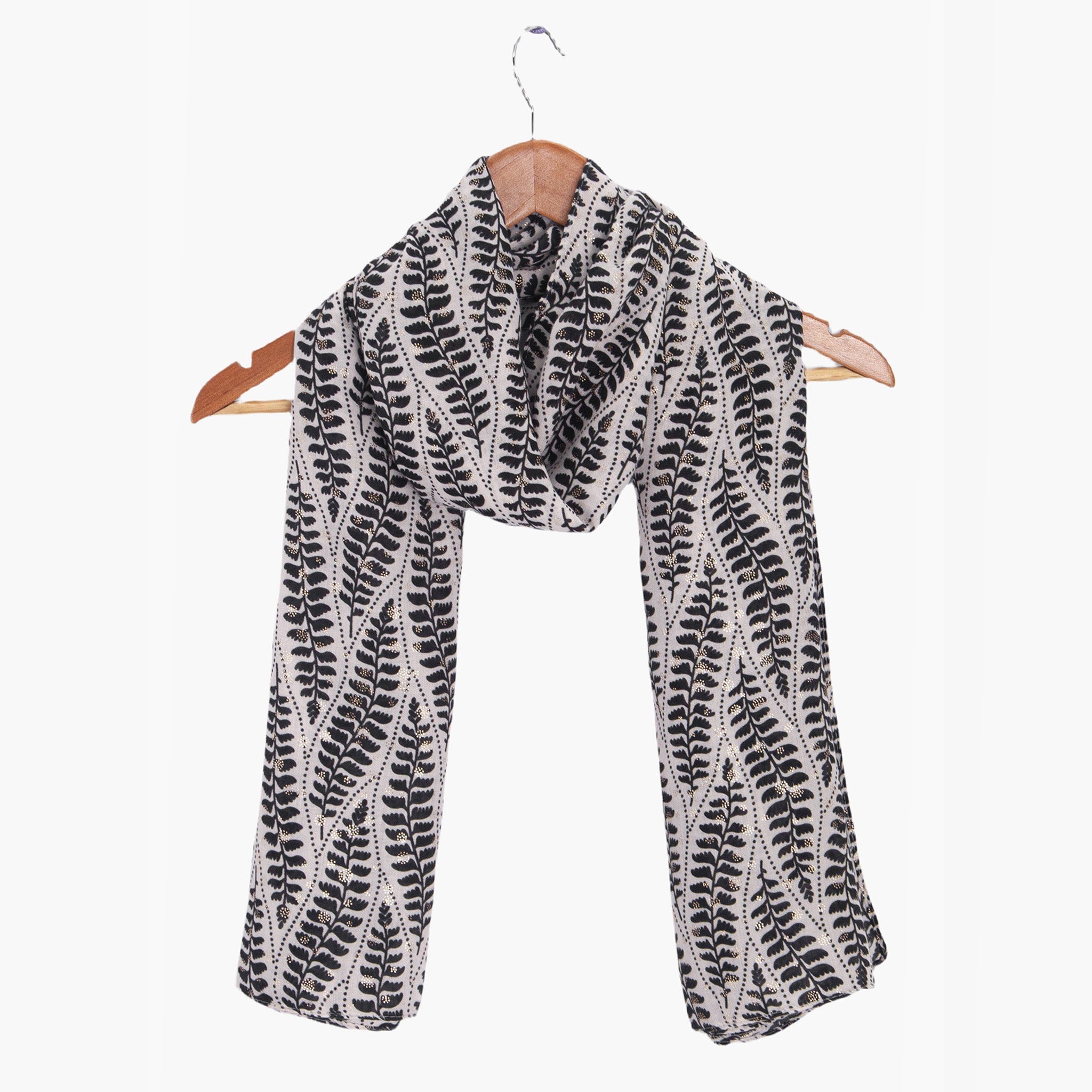 clover-cream-fern-leaf-lightweight-scarf-draped-on-coat-hanger