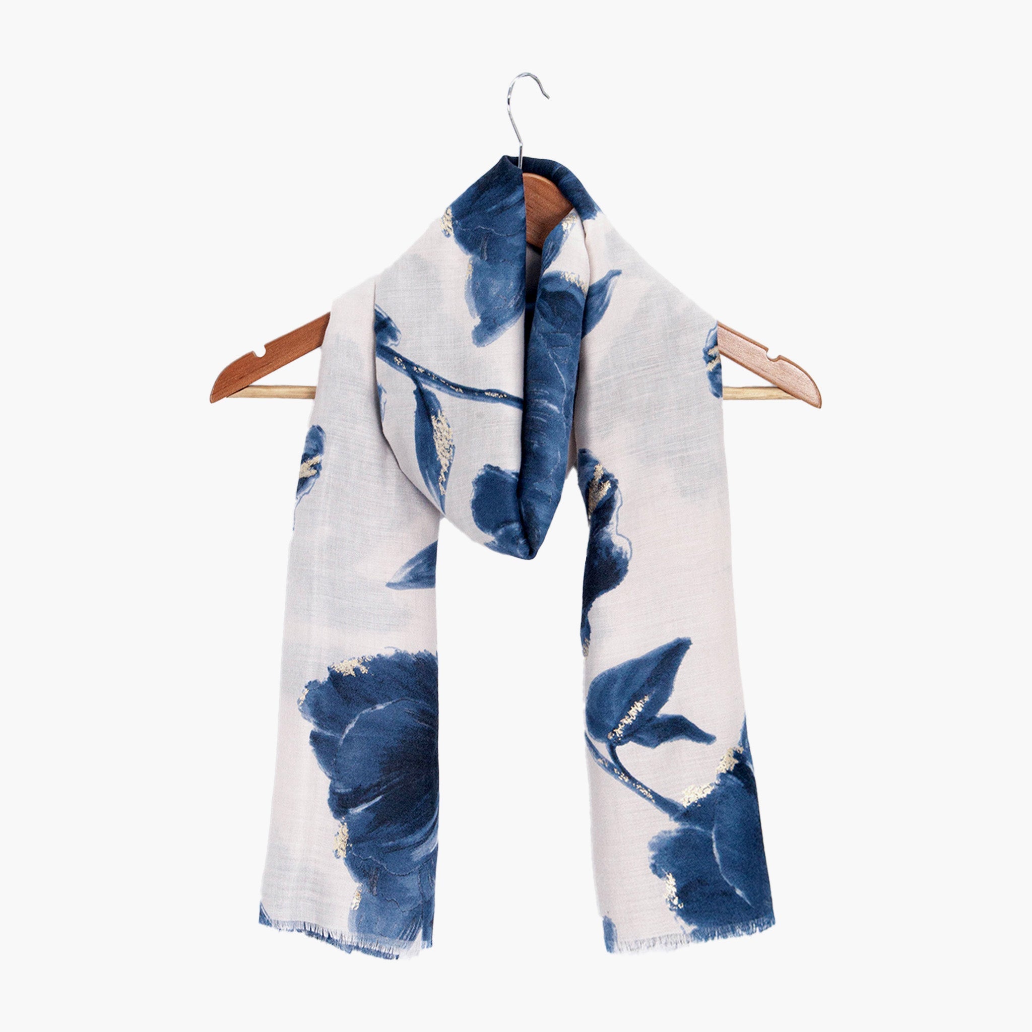 eleanor-blue-abstract-floral-lightweight-scarf-draped-on-coat-hanger
