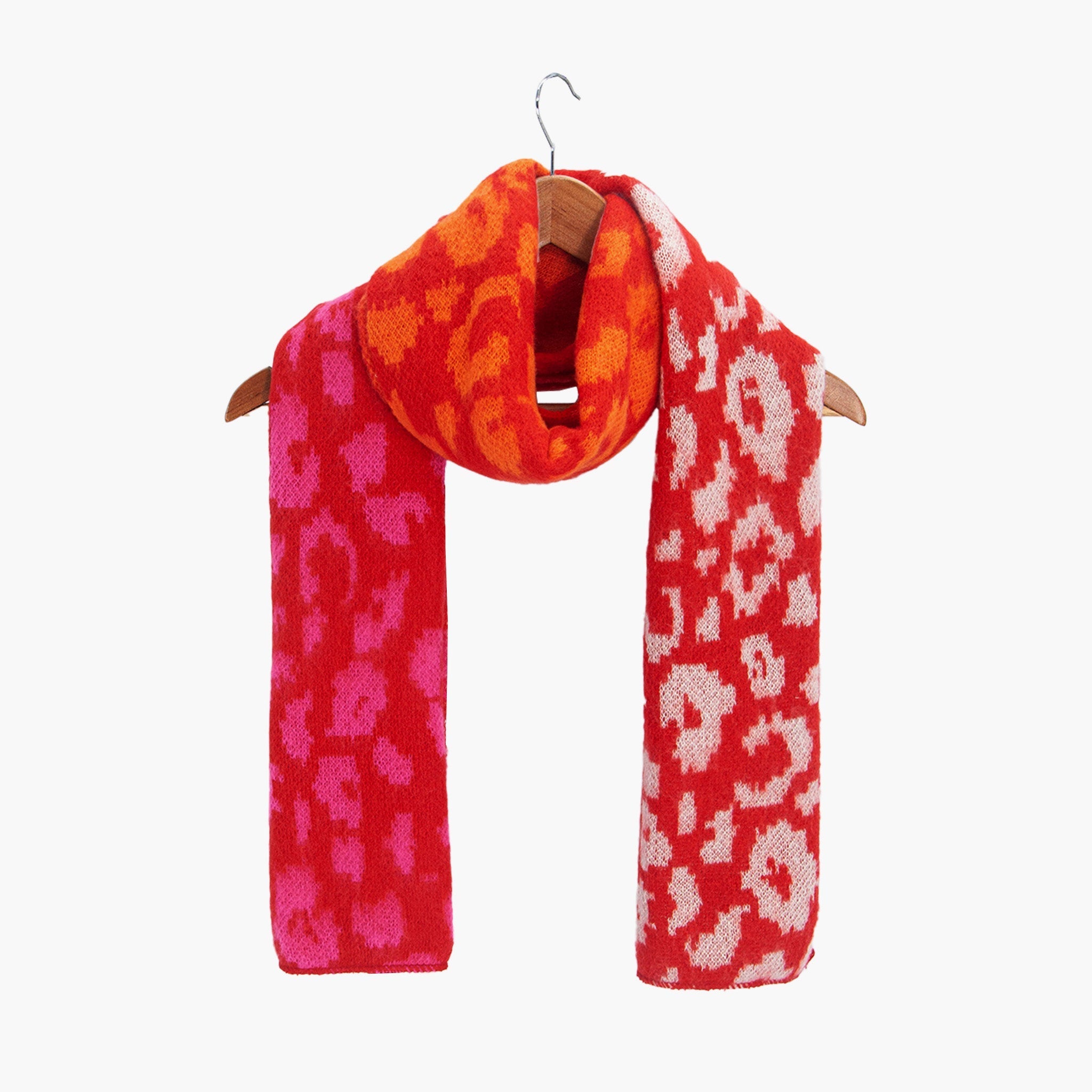 kyra-red-leopard-heavyweight-scarf-draped-on-coat-hanger