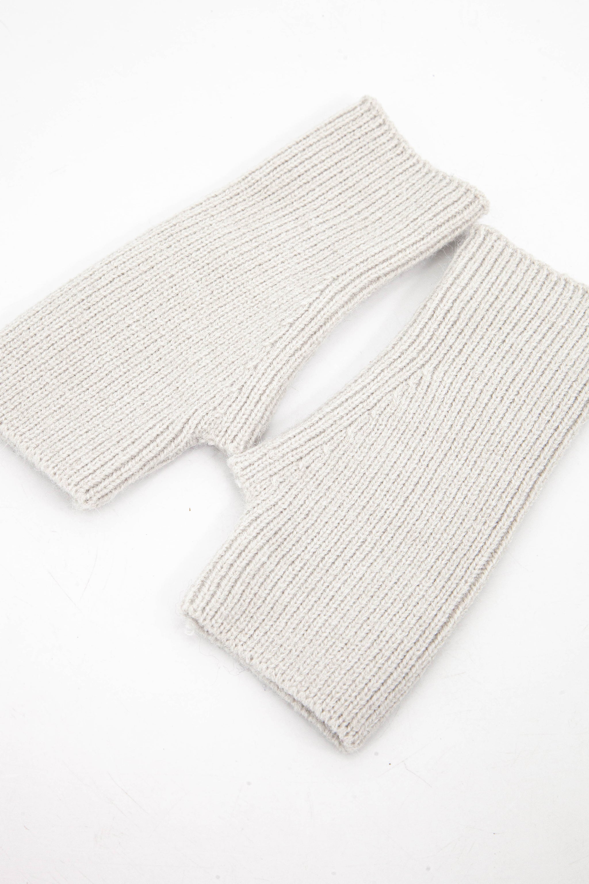 light grey knitted wrist warmer gloves with thumb holes