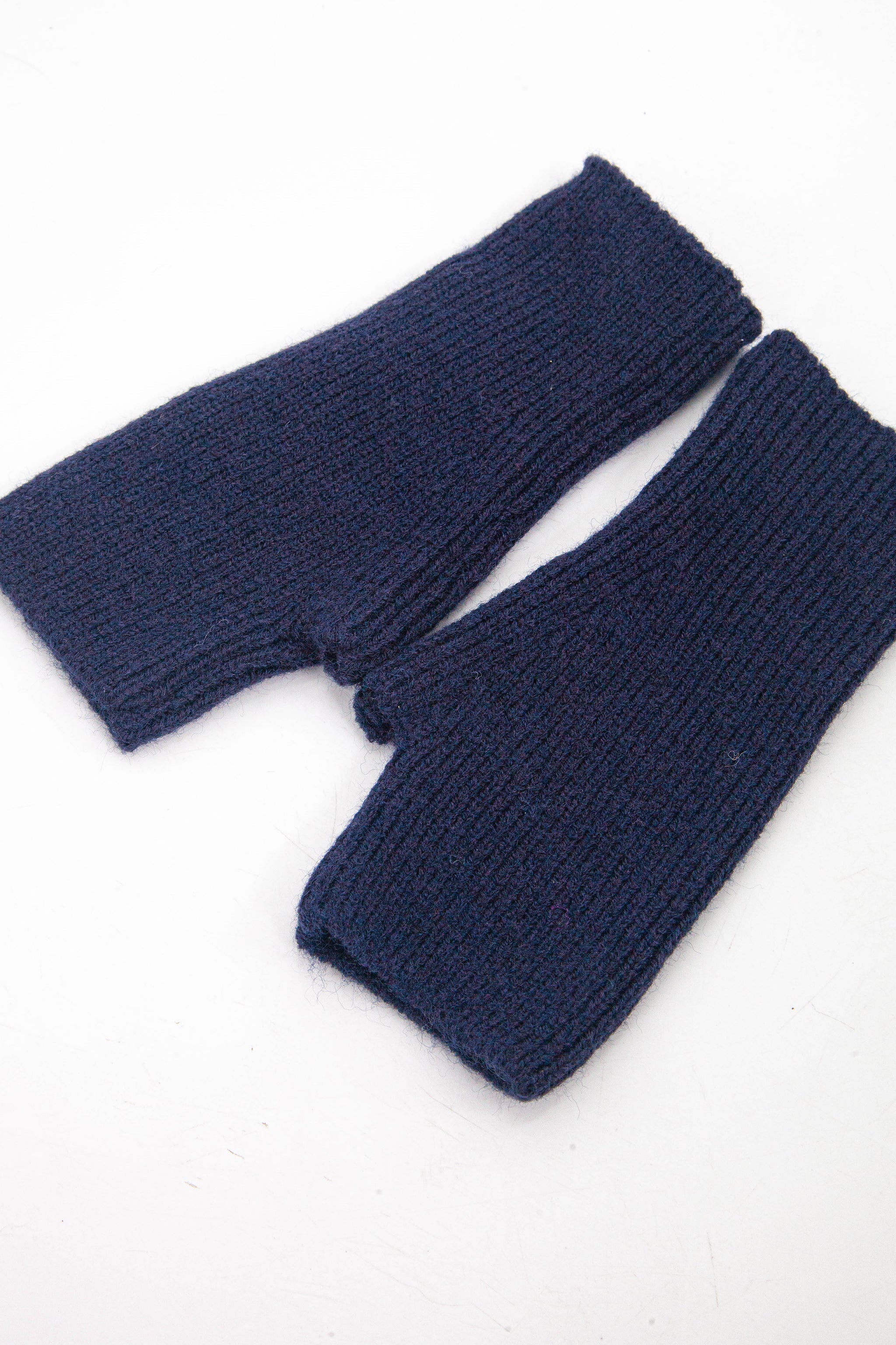 navy blue knitted wrist warmer gloves with thumb holes