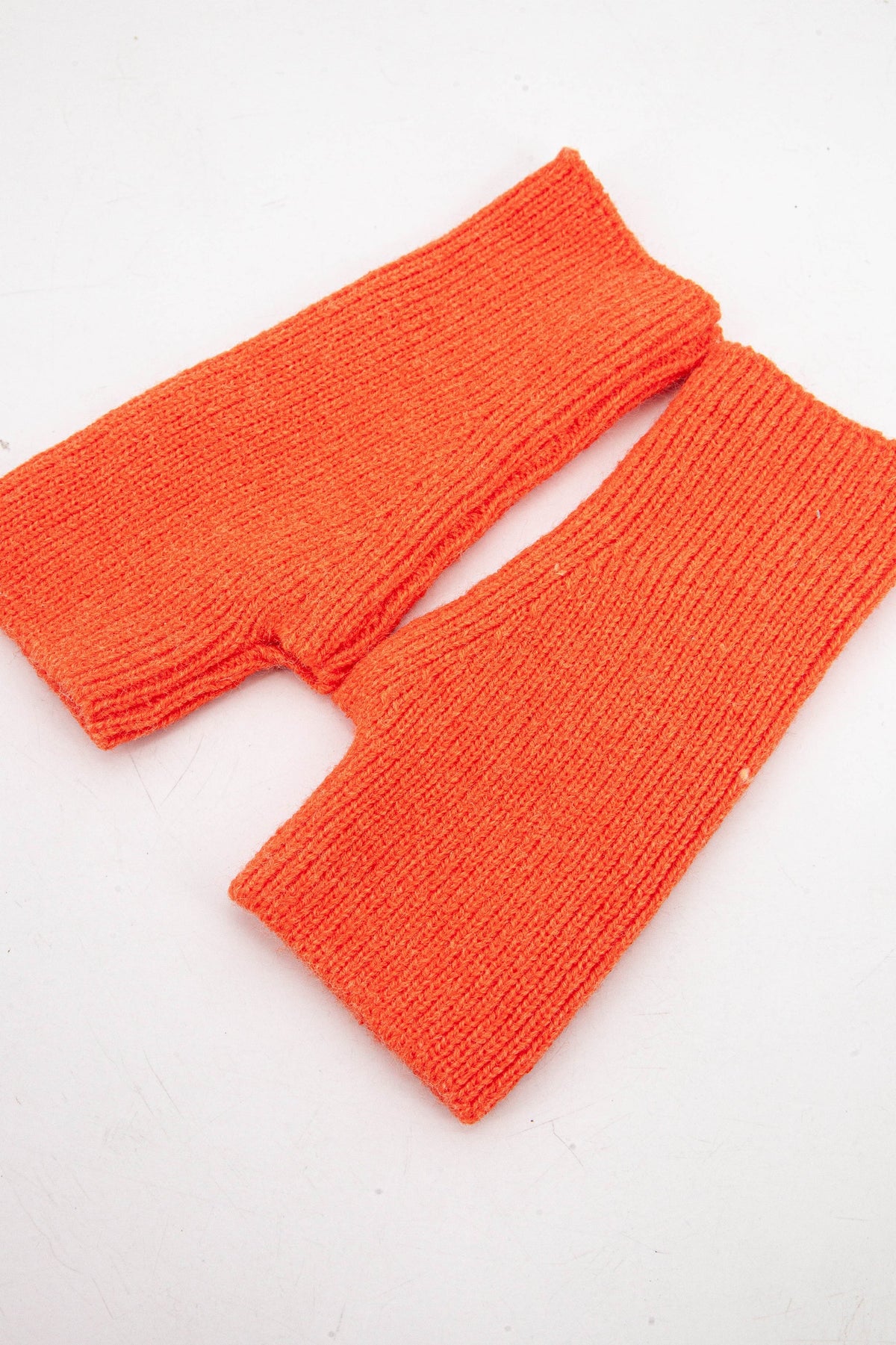 orange knitted wrist warmer gloves with thumb holes