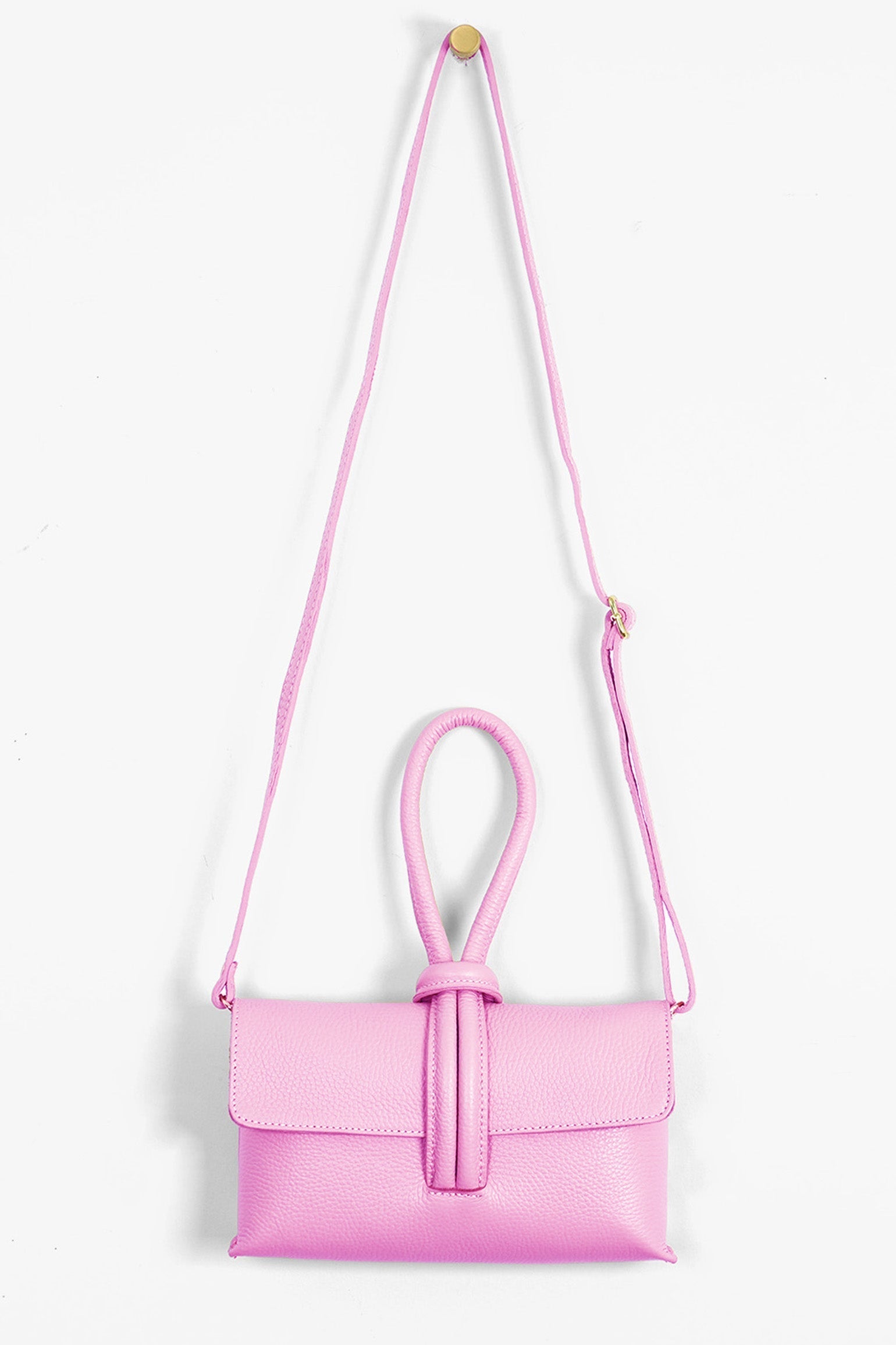 Trixie-Clutch-Bag-Pebbled-Italian-Leather-in-Hot-Pink-Front-Showing-Adjustable-Strap