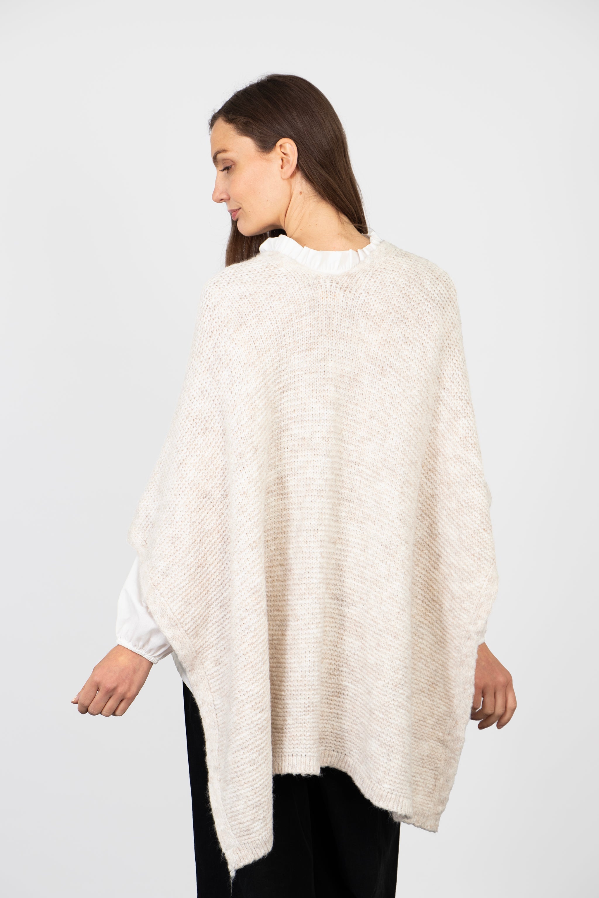 model showing the back of the wrap, showing the round neck at the back and the plain cream colour