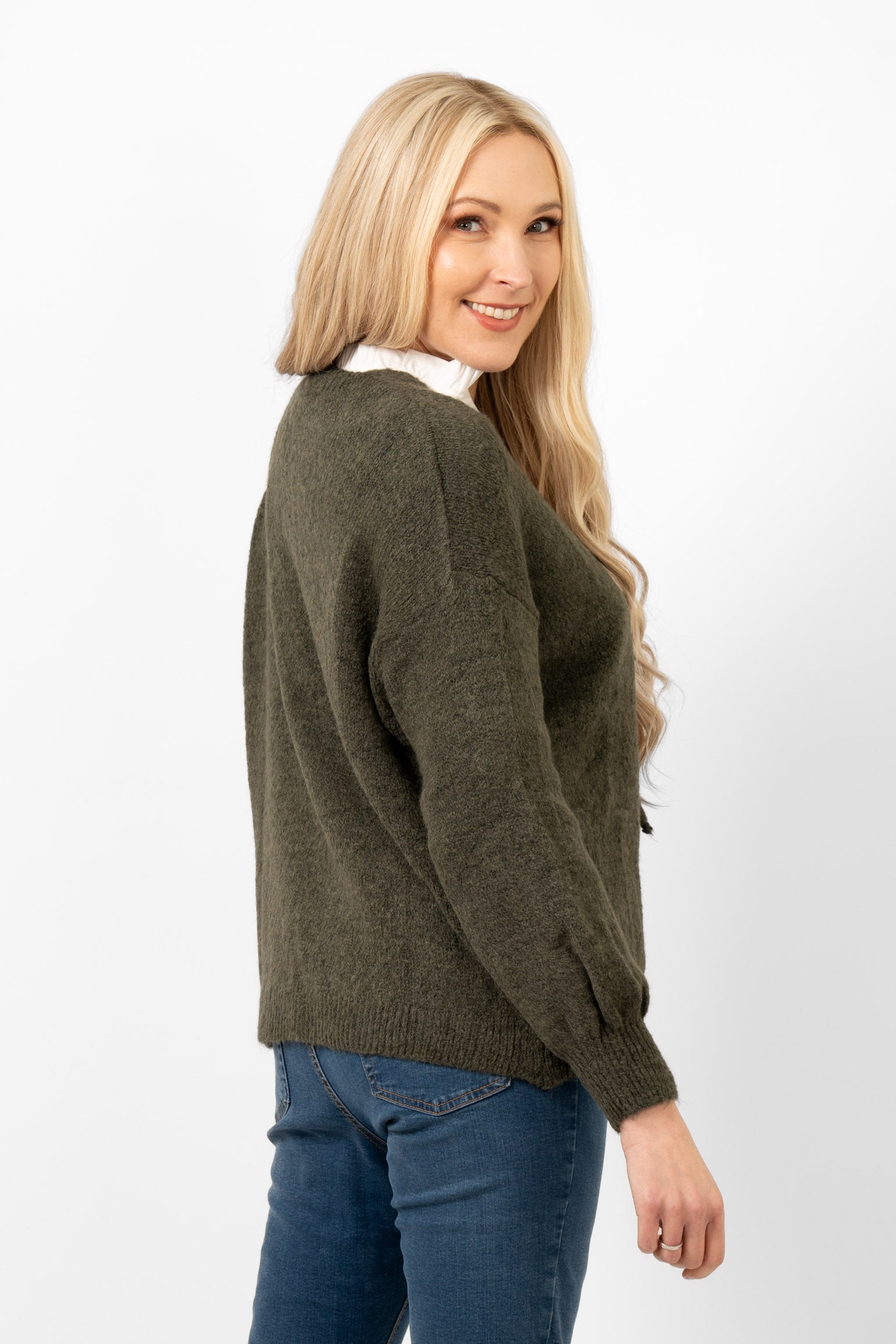 khaki front tie knitted cardigan shown from the back and side. the hemline falls at the hips, making this a short cardigan. the sleeves are full length and the colour is plain khaki green all over.