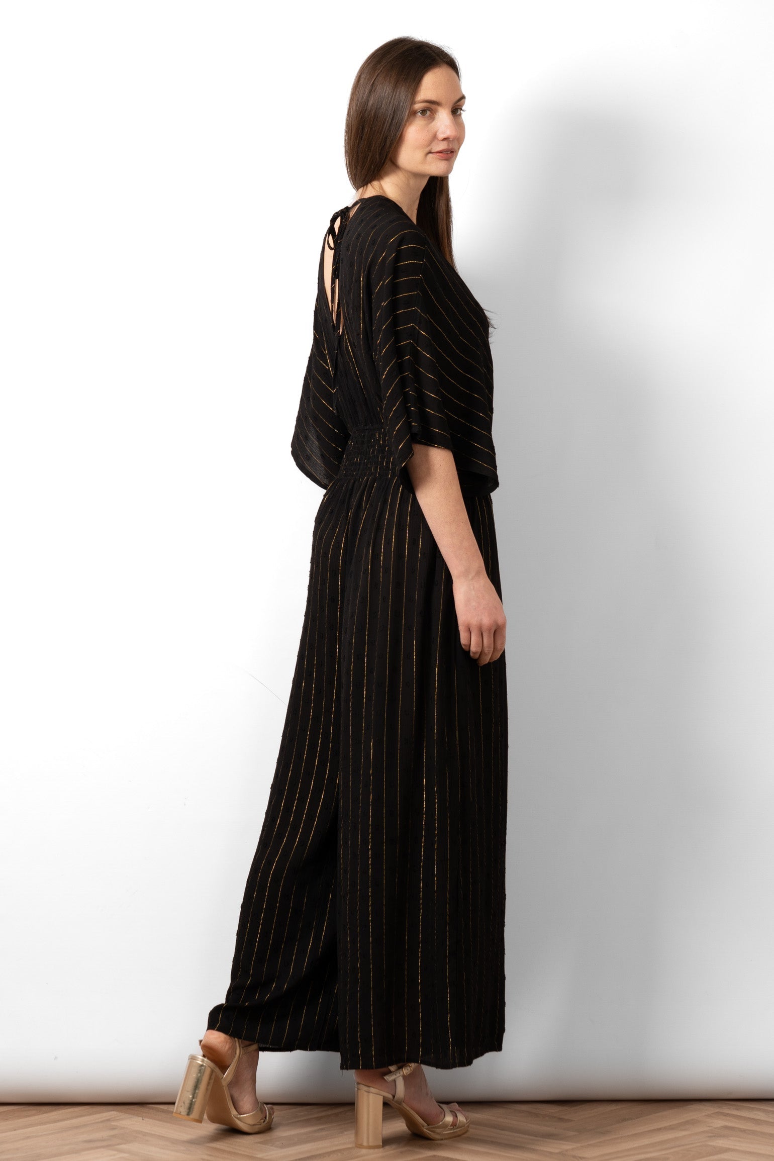 lyra-deep-v-neck-jumpsuit-black-metallic-stripe-gold-pinstripe