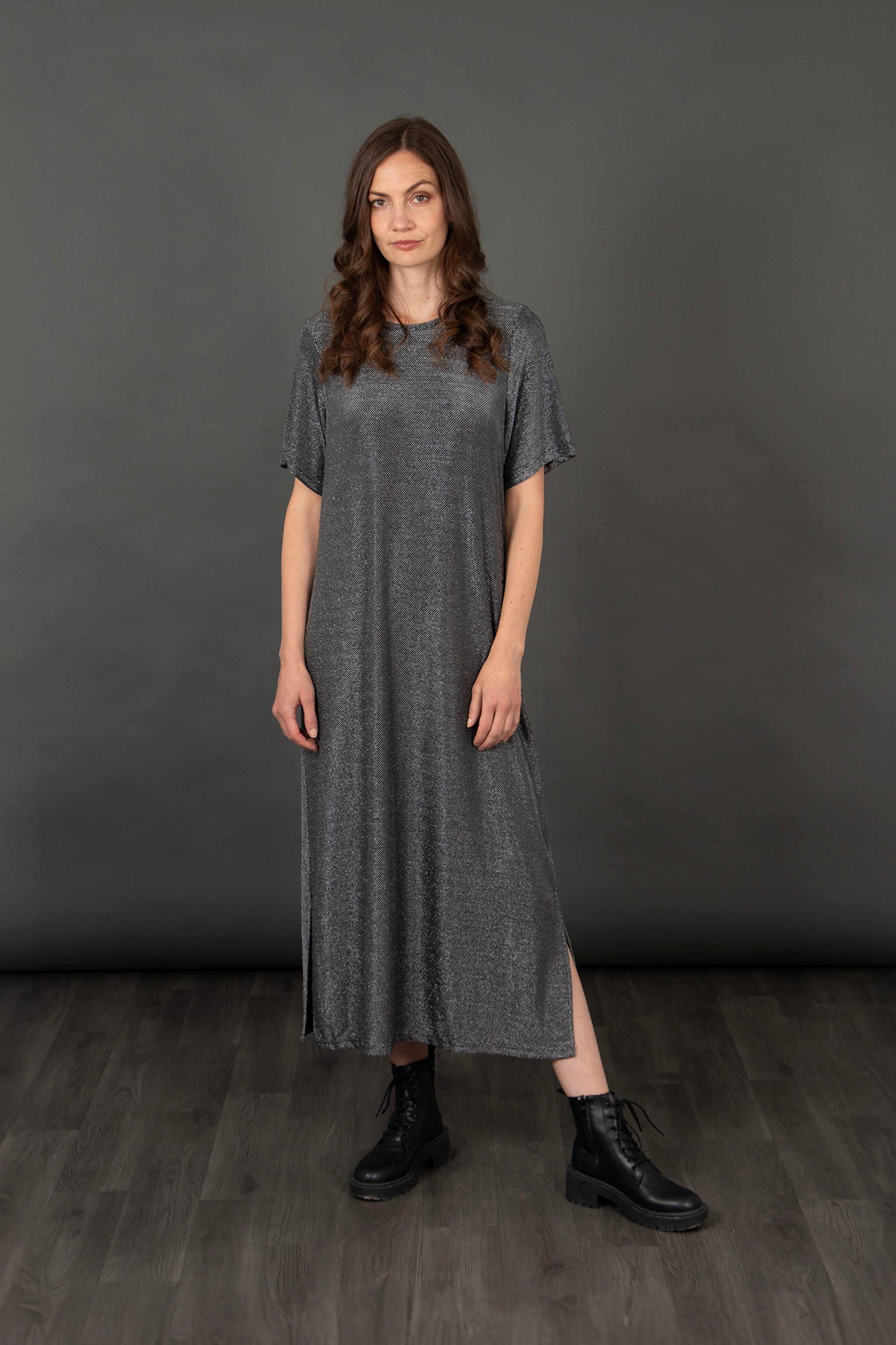 model wearing a silver metallic glitter maxi t-shirt dress with short sleeves and a round neck
