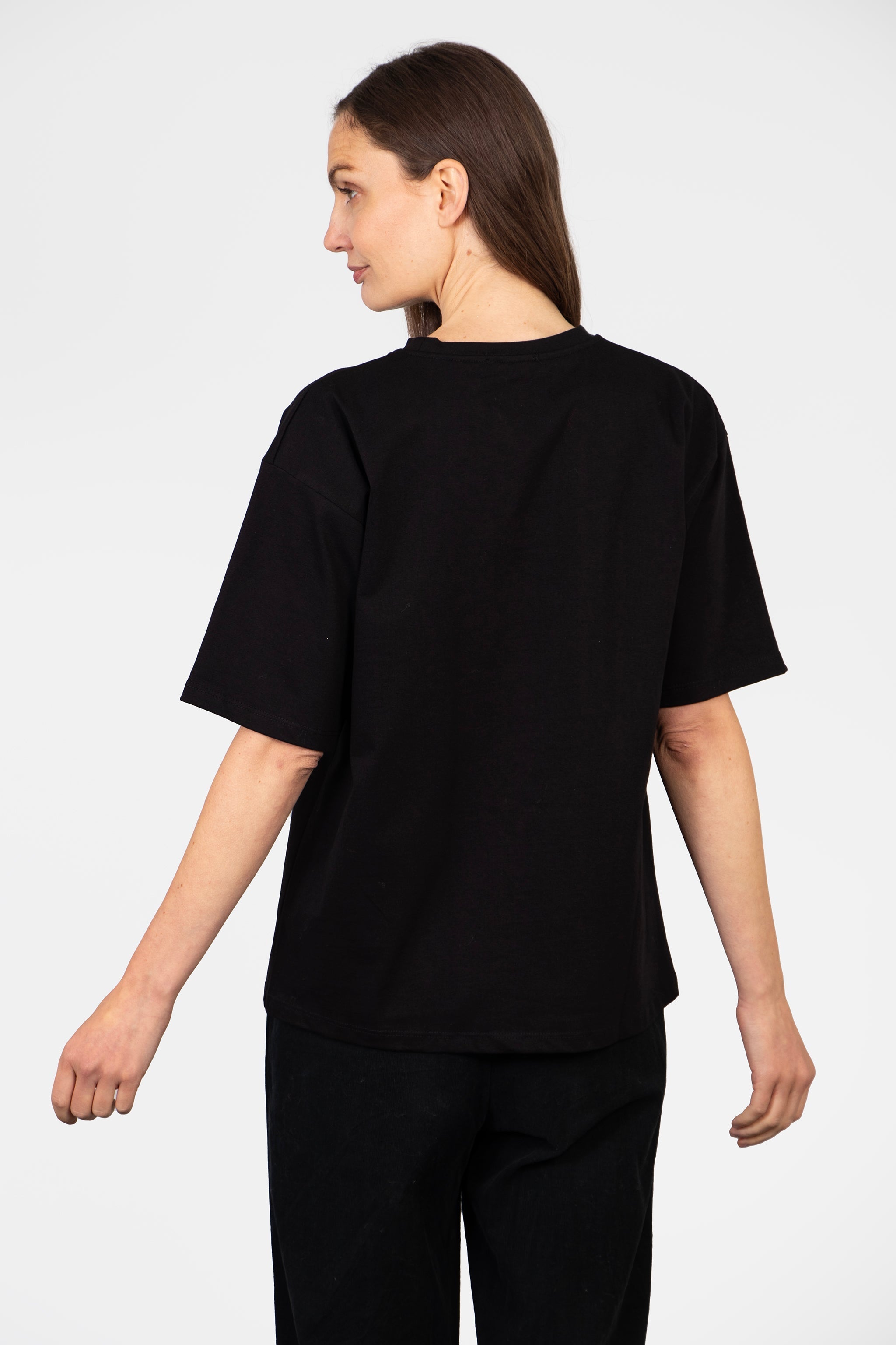 model showing the back of the t-shirt which is plain black