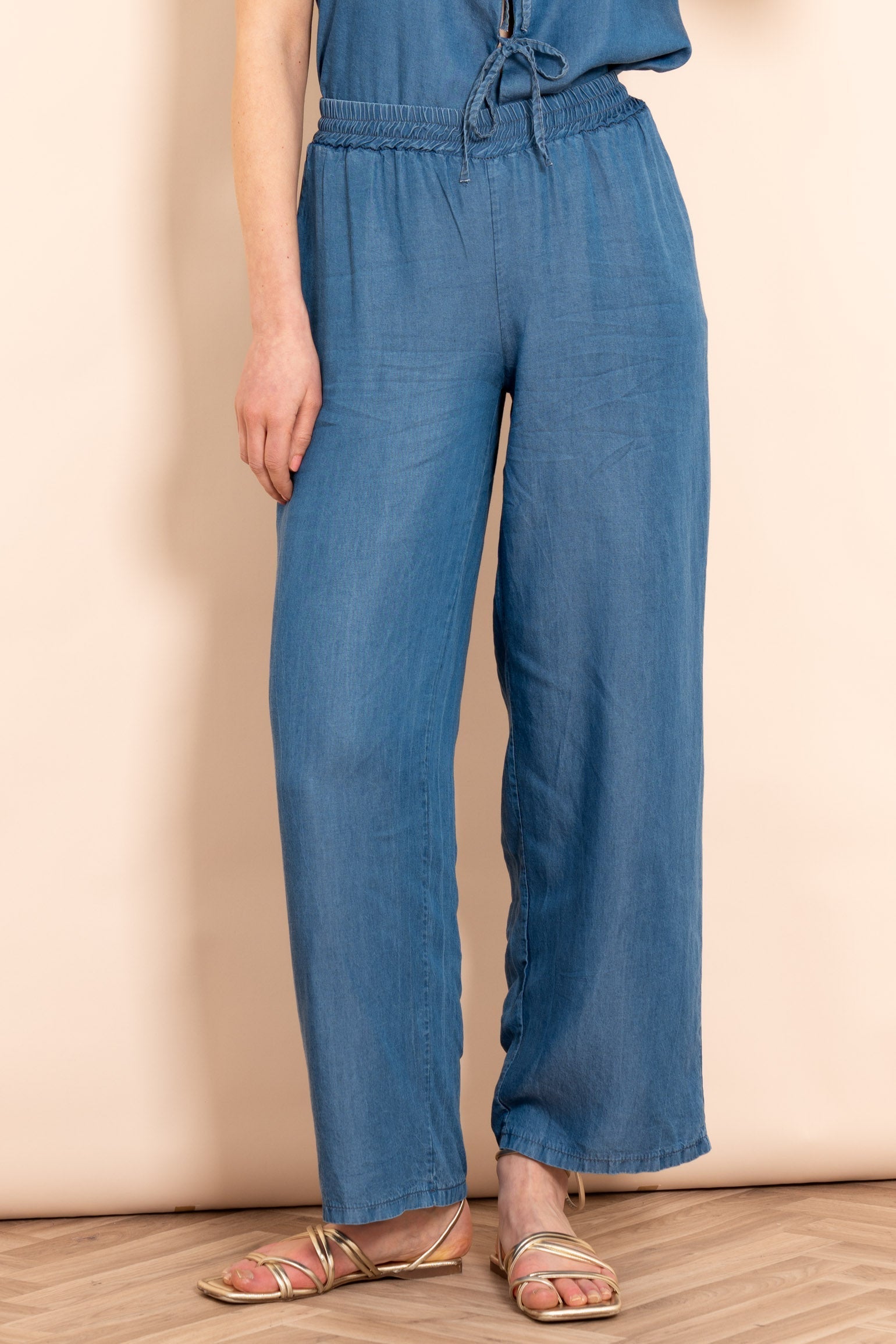ezra-wide-leg-trousers-blue-chambray-front-on-model