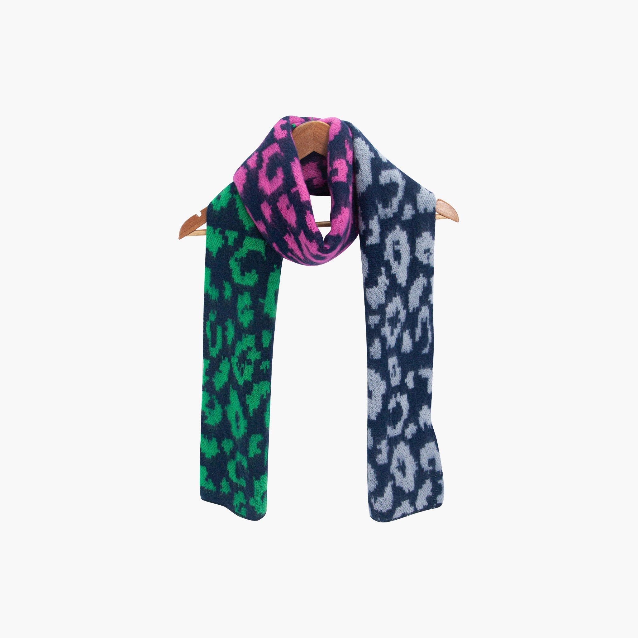 kyra-navy-blue-leopard-heavyweight-scarf-draped-on-coat-hanger