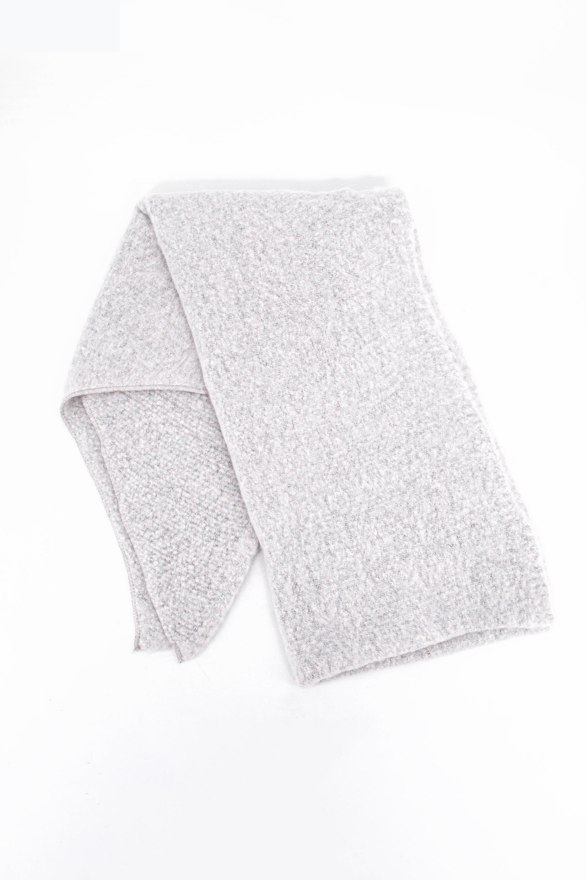 showing the scarf folded highlighting the solid light grey colour