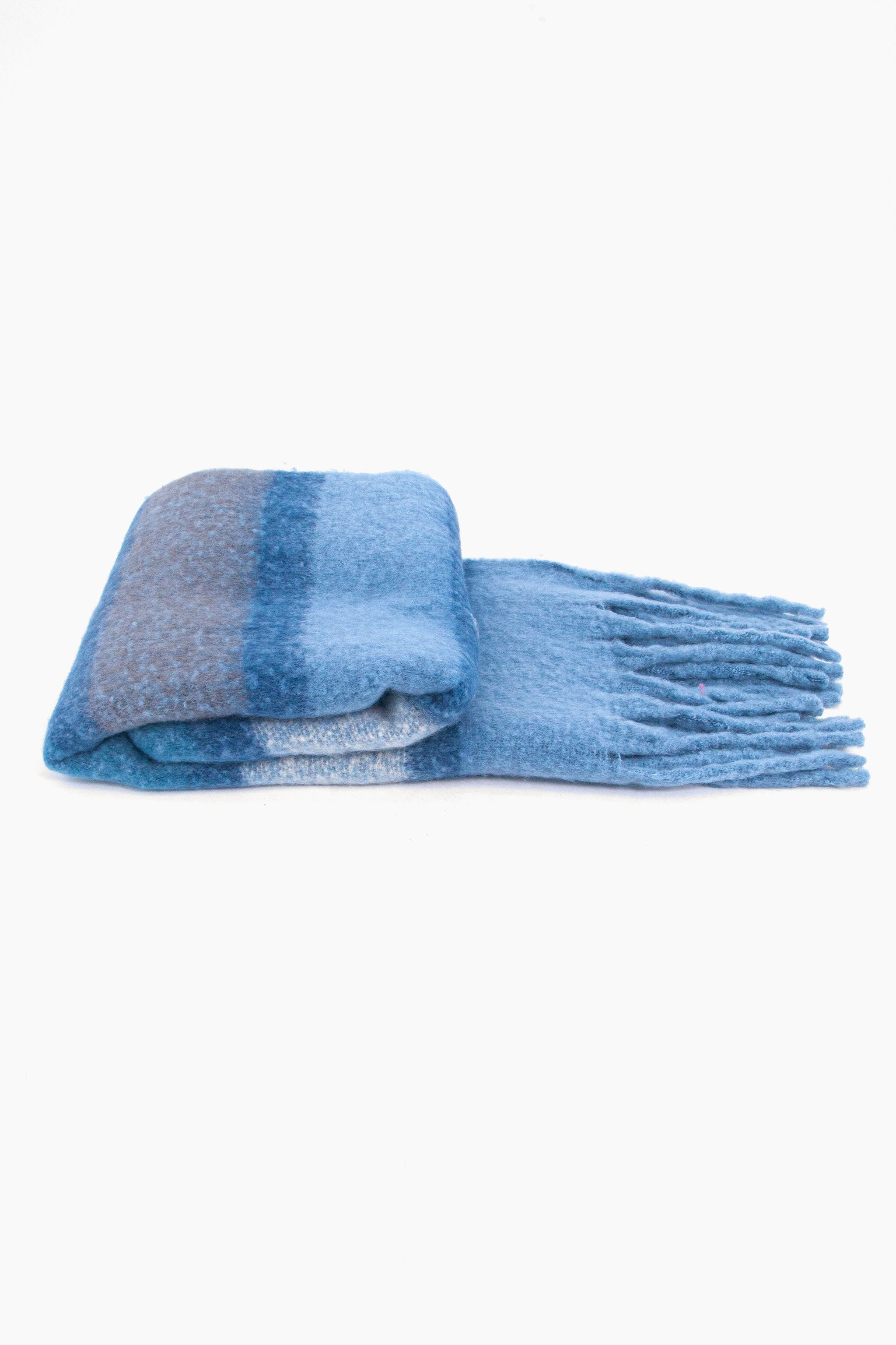 side view of the scarf when folder, showing the texture and thickness of the material. this scarf is warm and winter weight