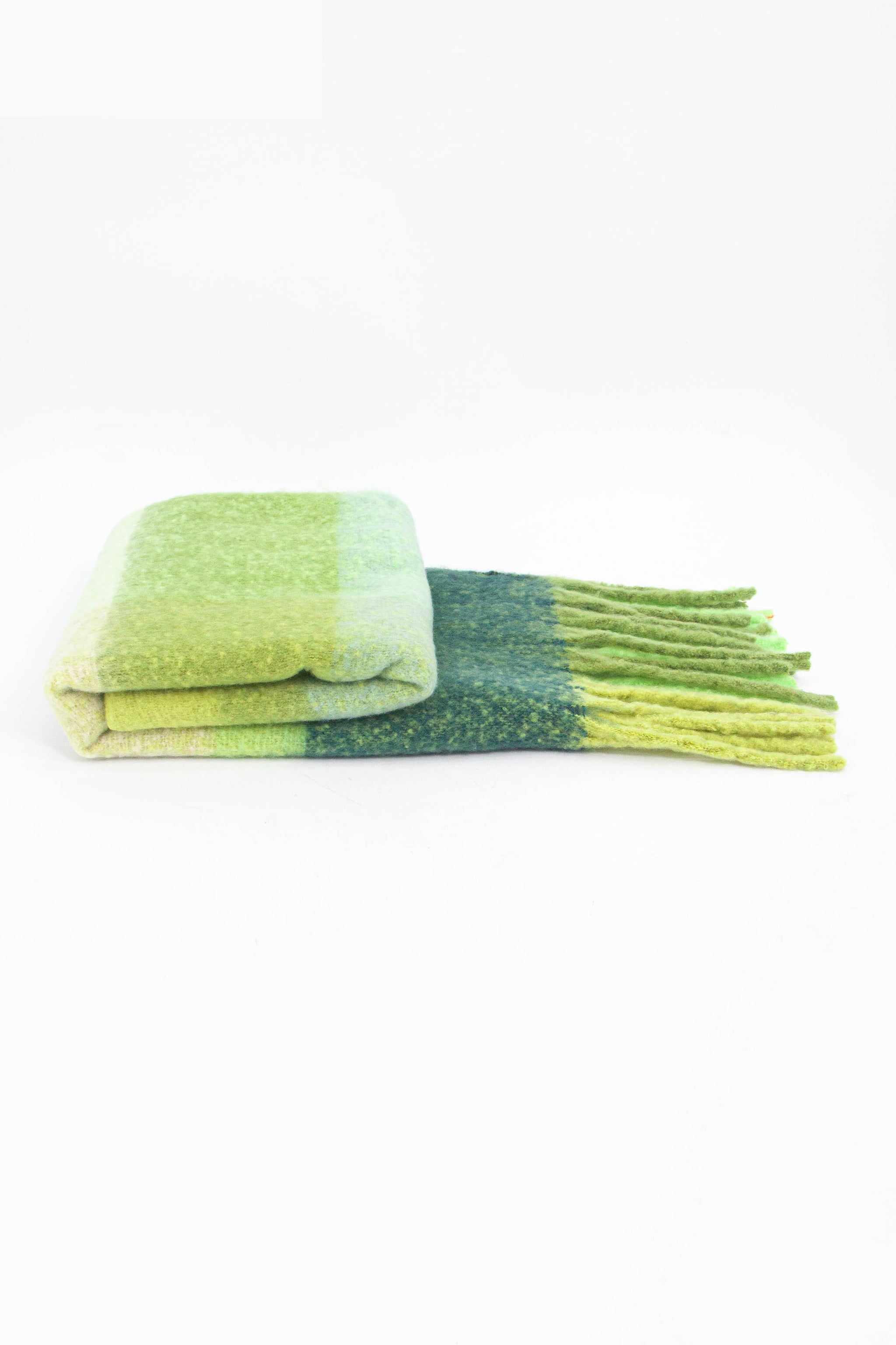 side view of the scarf when folder, showing the texture and thickness of the material. this scarf is warm and winter weight