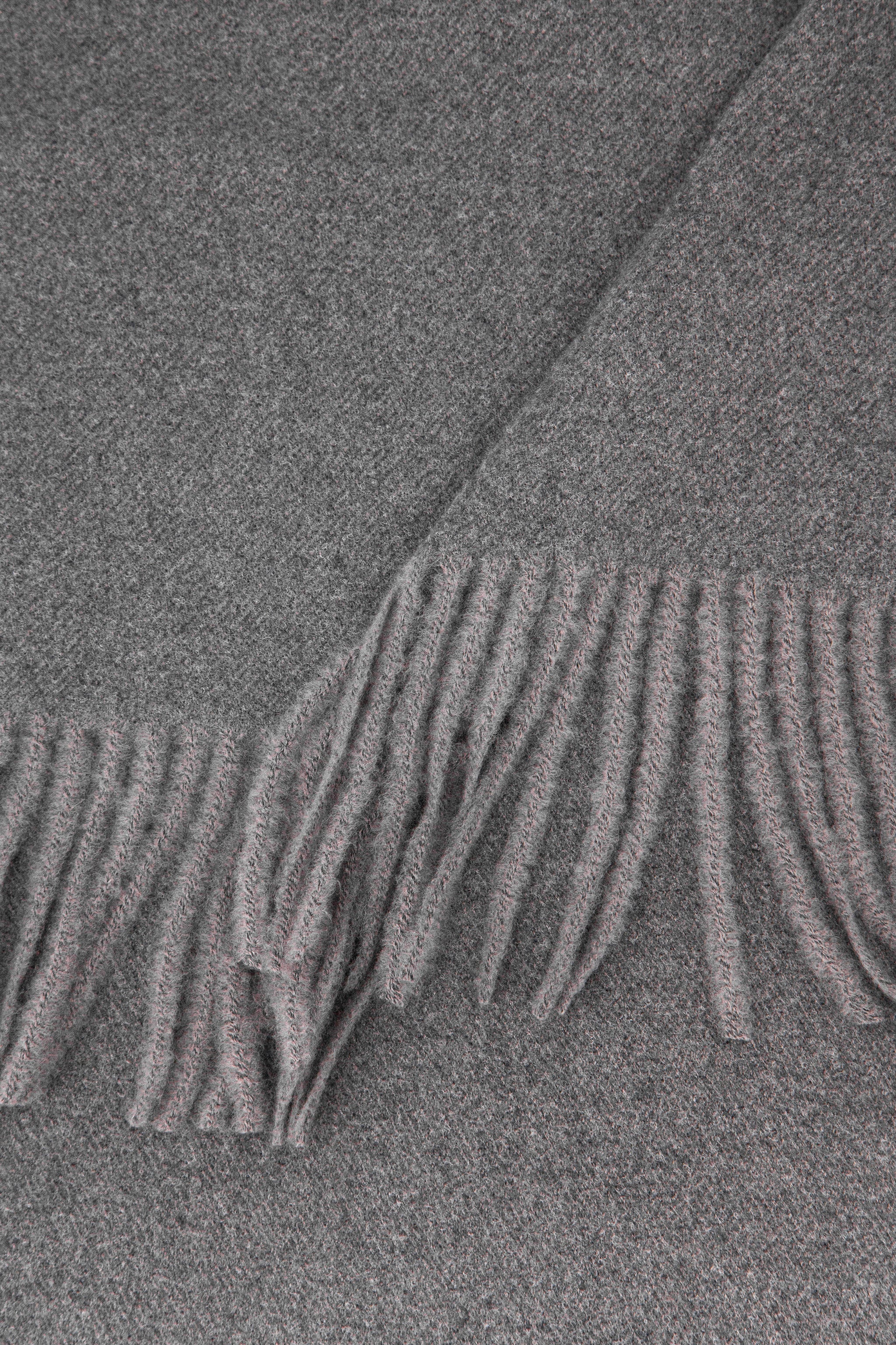 close up of the soft viscose knitted material of the winter blanket scarf