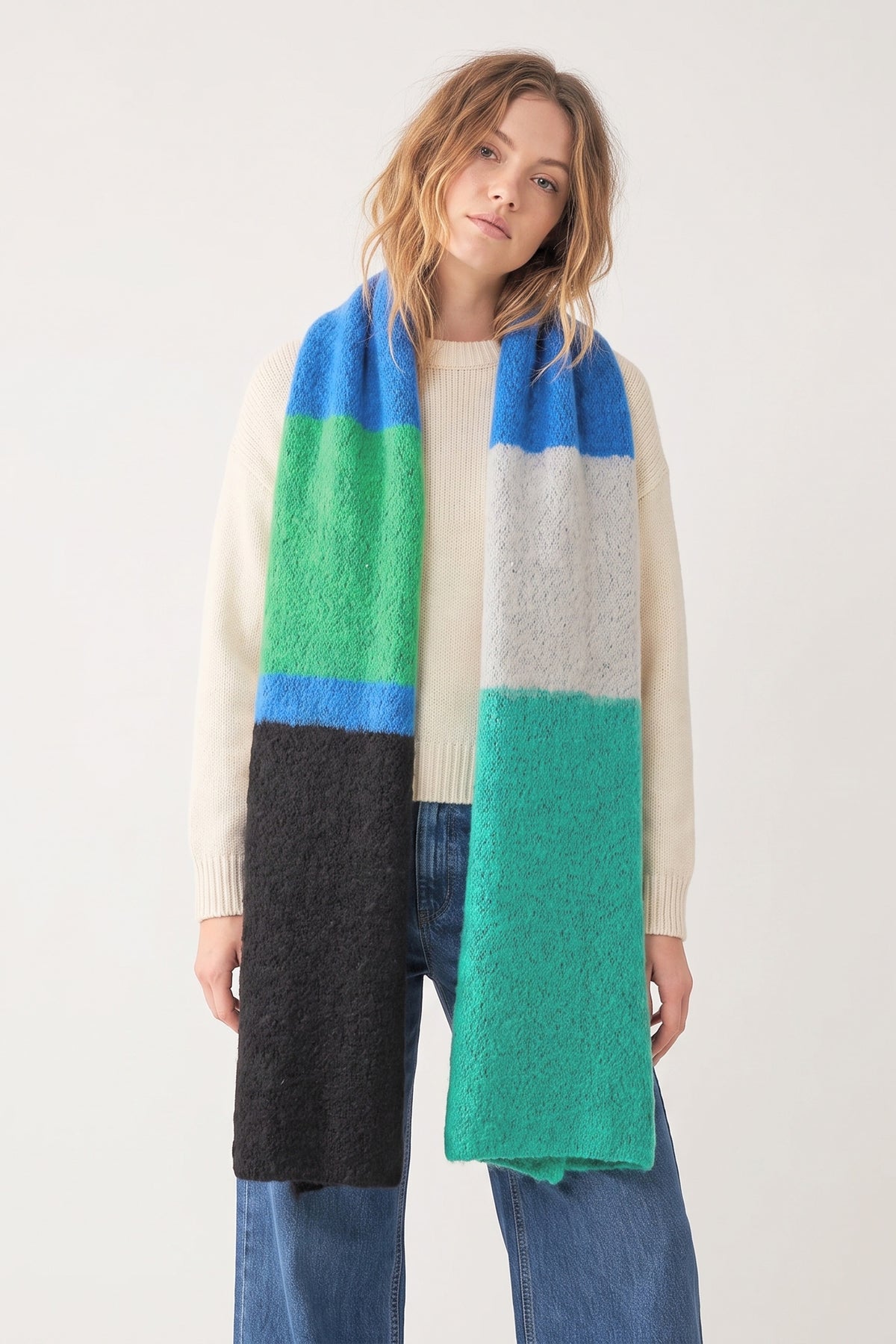 heavyweight knitted winter scarf in a colour block pattern, the scarf is green, blue and black