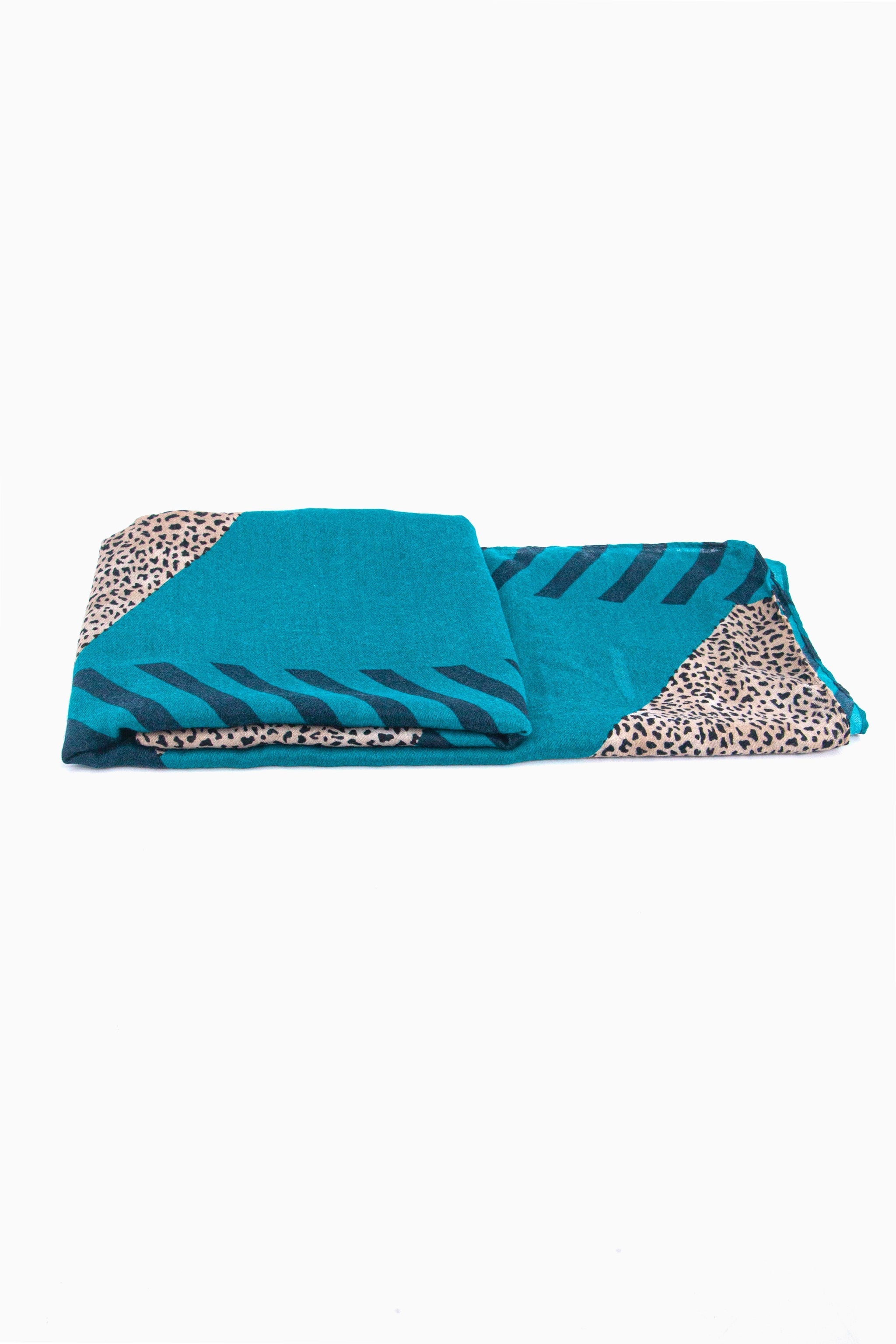 side view of the scarf when folded, showing the texture and thickness of the material. this scarf is lightweight
