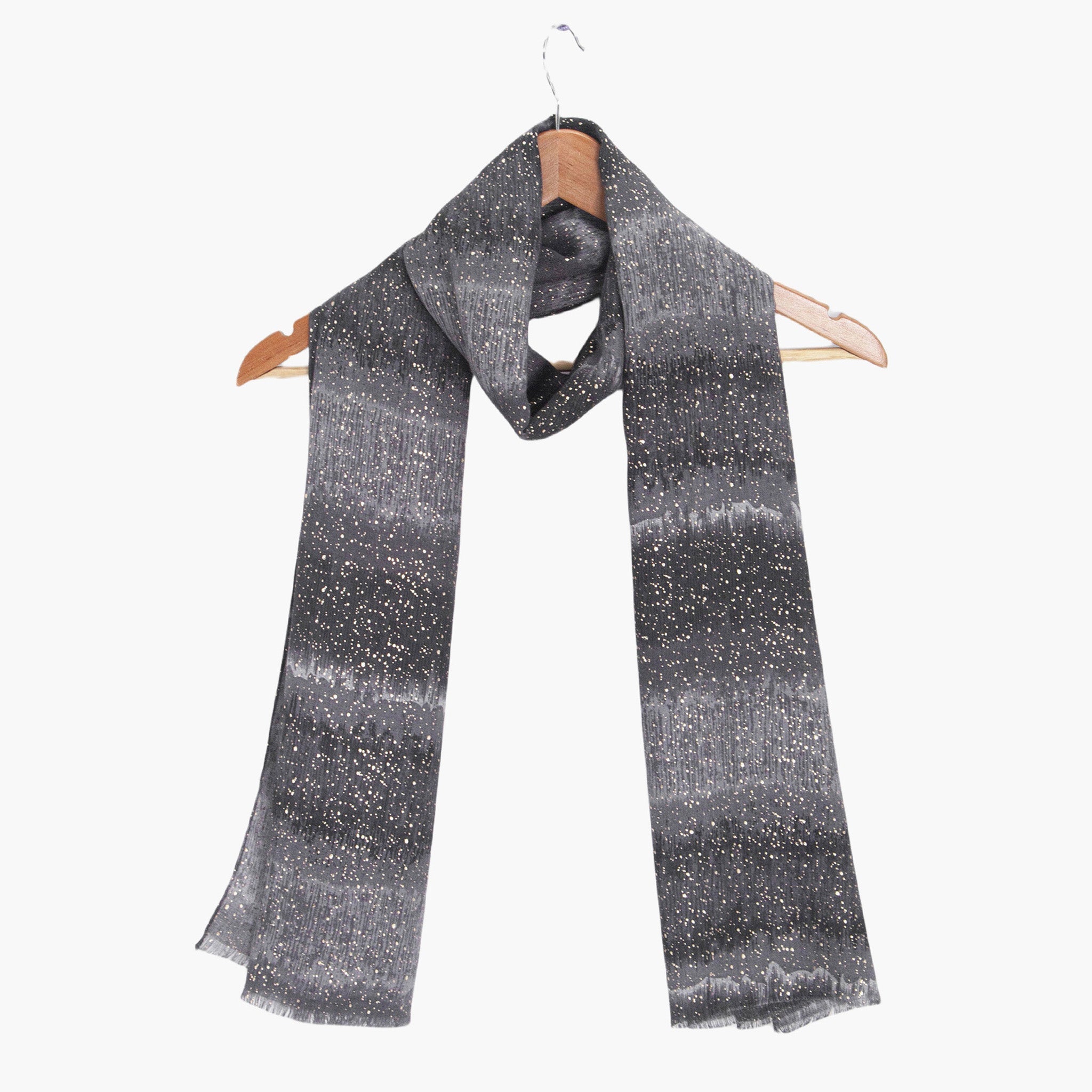 tierney-black-ombre-stripe-lightweight-scarf-draped-on-coat-hanger