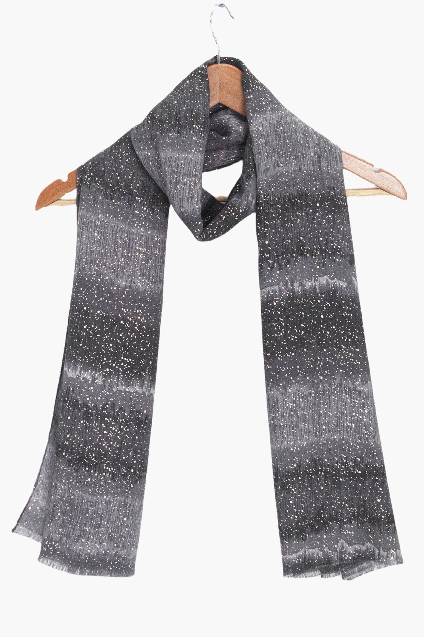 tierney-black-ombre-stripe-lightweight-scarf-draped-on-coat-hanger