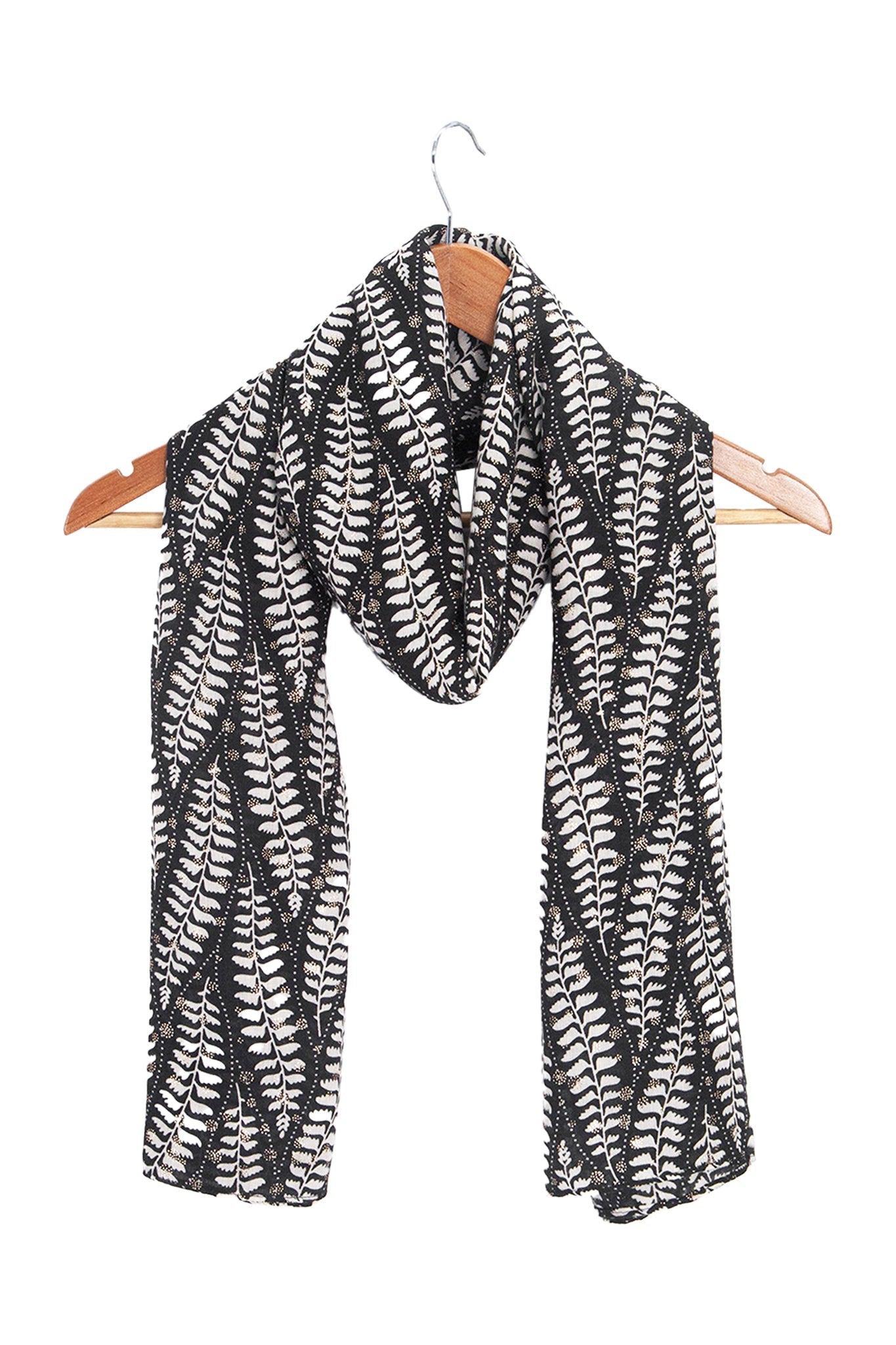 clover-black-fern-leaf-lightweight-scarf-draped-on-coat-hanger