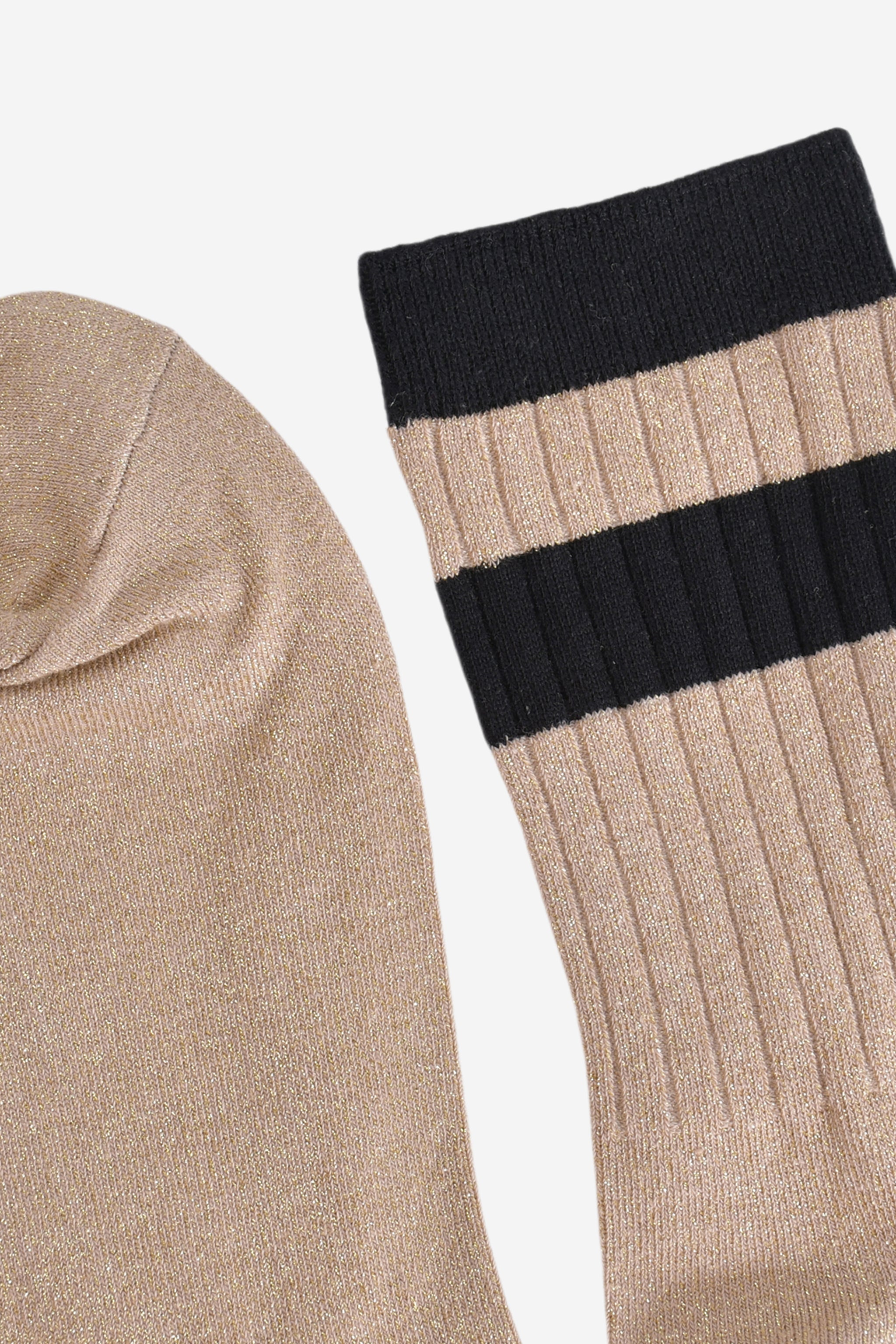 close up of the toe and cuff. the toe is gold and sparkly the same as the base of the socks. the cuff is black and without glitter.