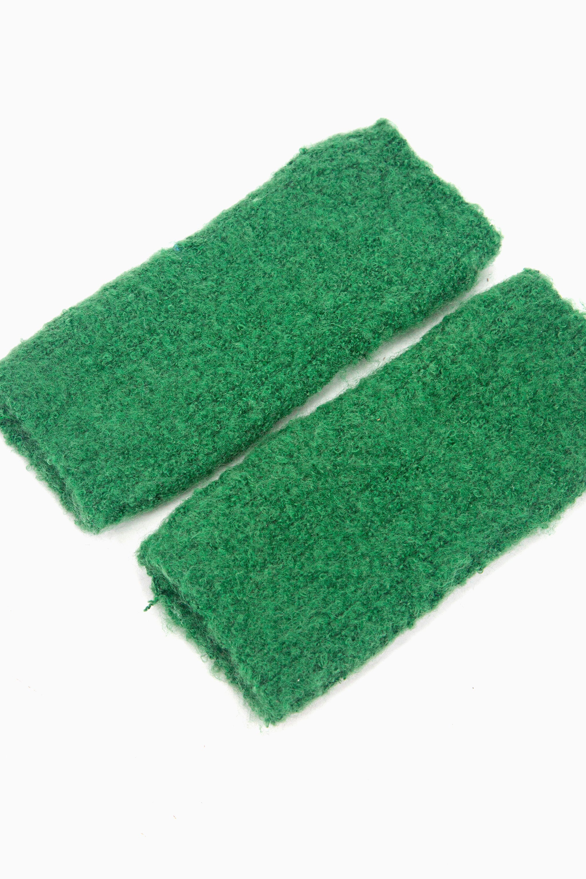 side view of the knitted wrist warmers, showing the opening at each end