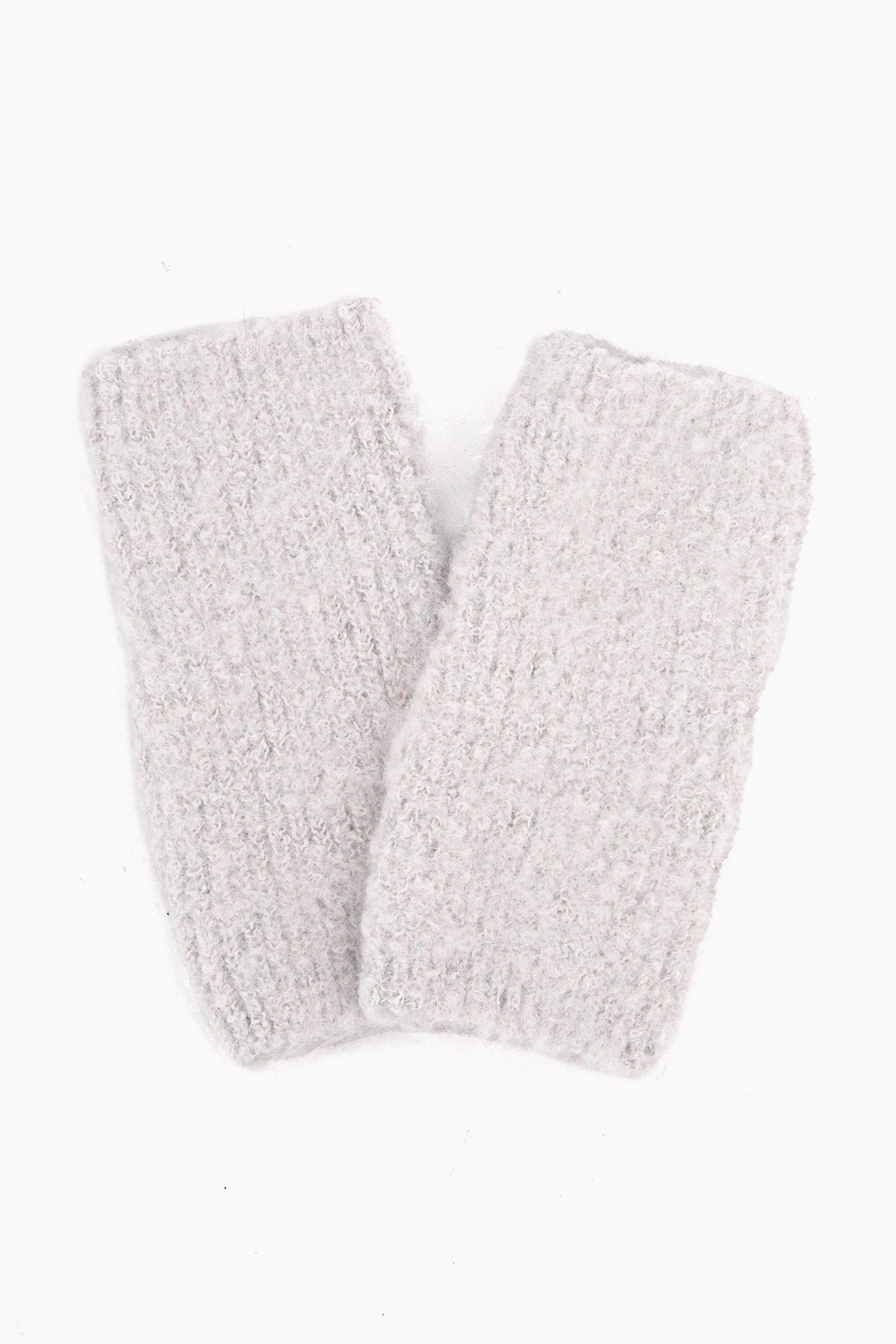 close up of the knitted wrist warmers showing the soft fabric