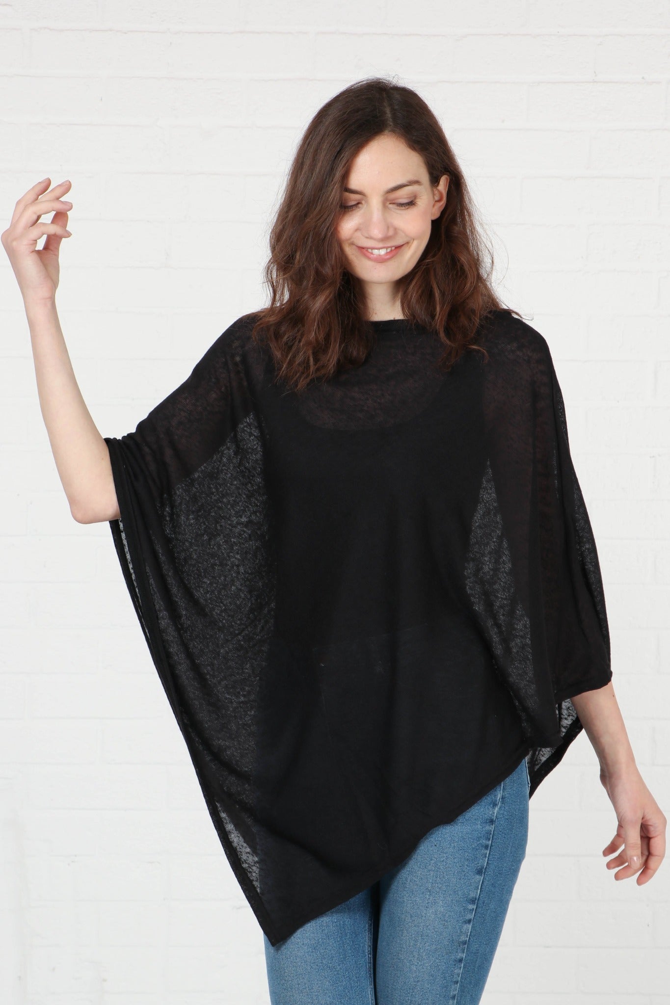 model showing the wide sleeves, the fall below the elbow.