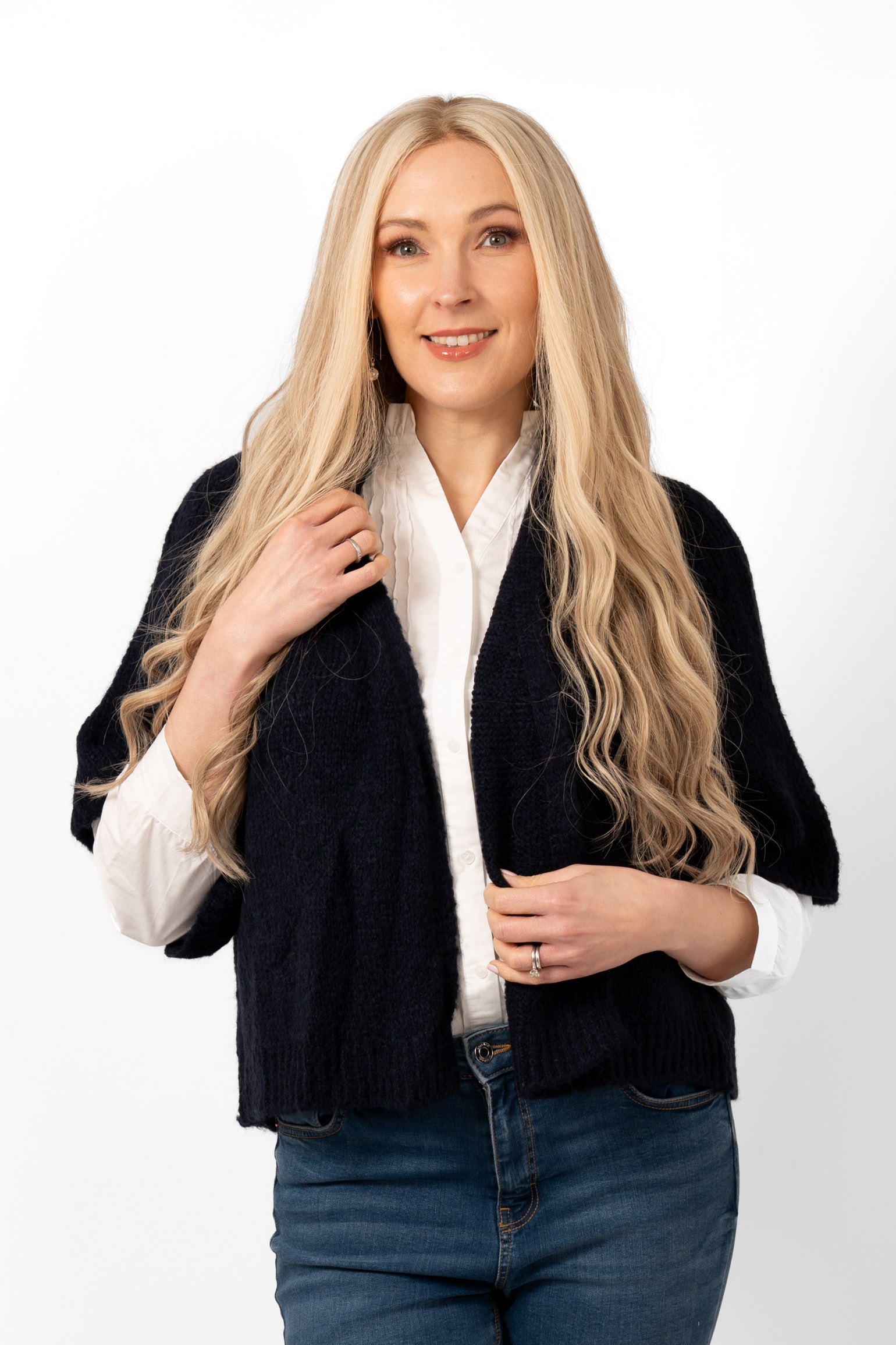 amelia-short-sleeve-wool-blend-cardigan-navy-blue-worn-by-a-model-showing-the-front-of-the-piece