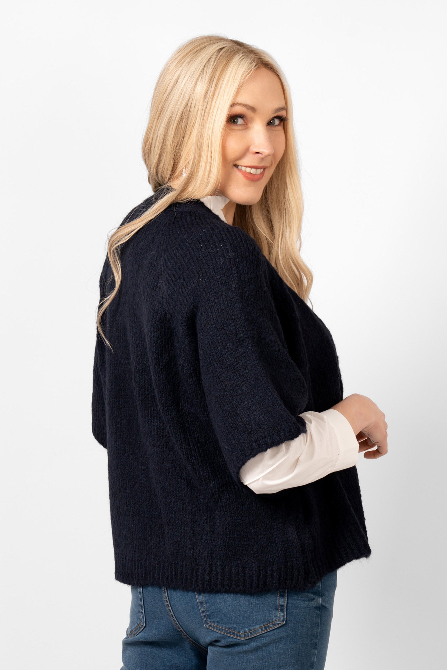 amelia-short-sleeve-wool-blend-cardigan-navy-blue-side-view-showing-the-loose-fitting-short-sleeves