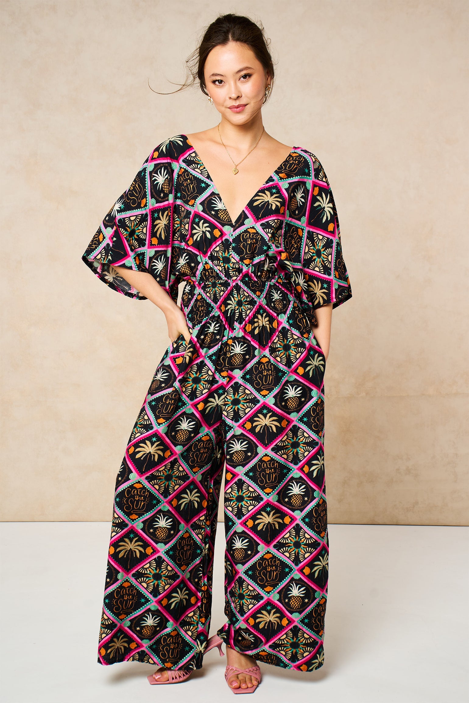 Pineapple-Print-V-Neck-Jumpsuit-in-Black-Front-Styled