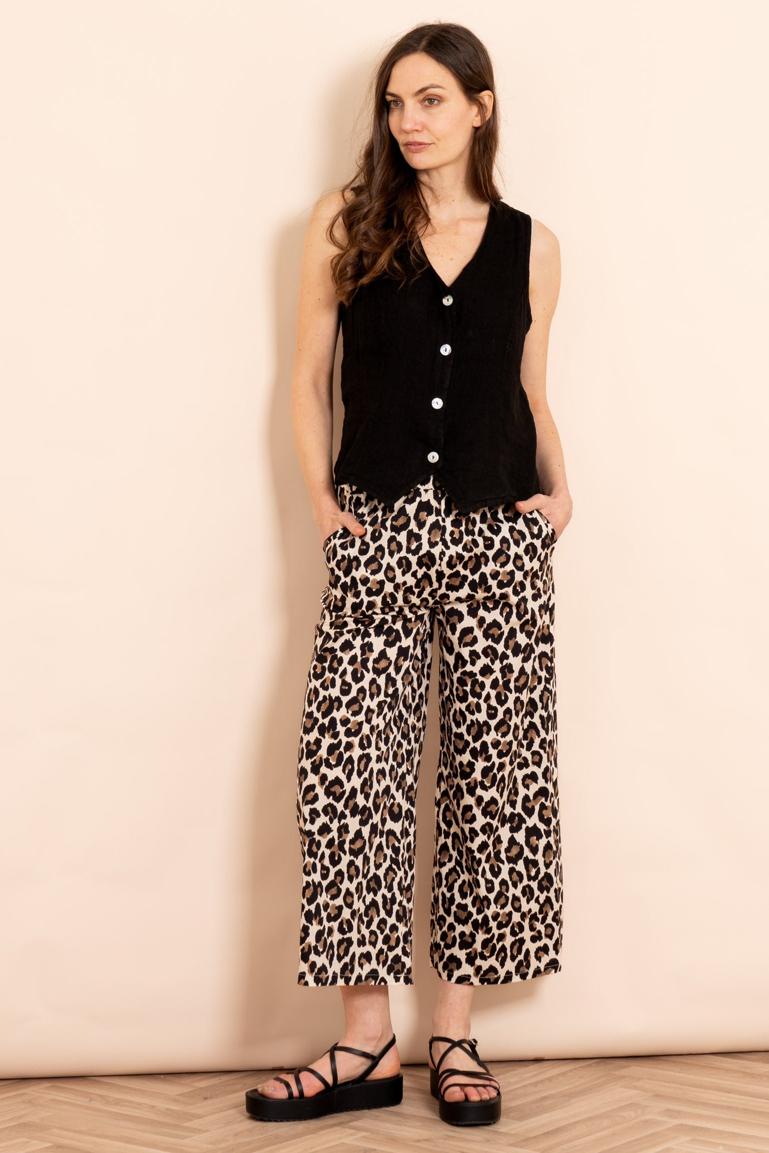 delilah-wide-leg-cropped-cotton-trousers-neutral-leopard-print-styled-on-model-sandals-black-waistcoat