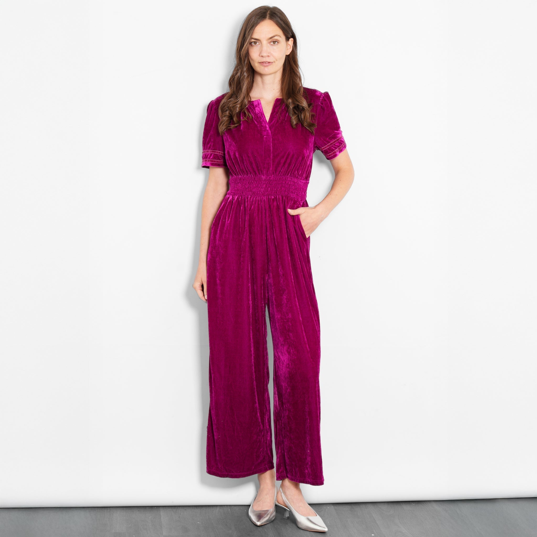 lydia-v-neck-jumpsuit-berry-velvet-model-front-view-pockets