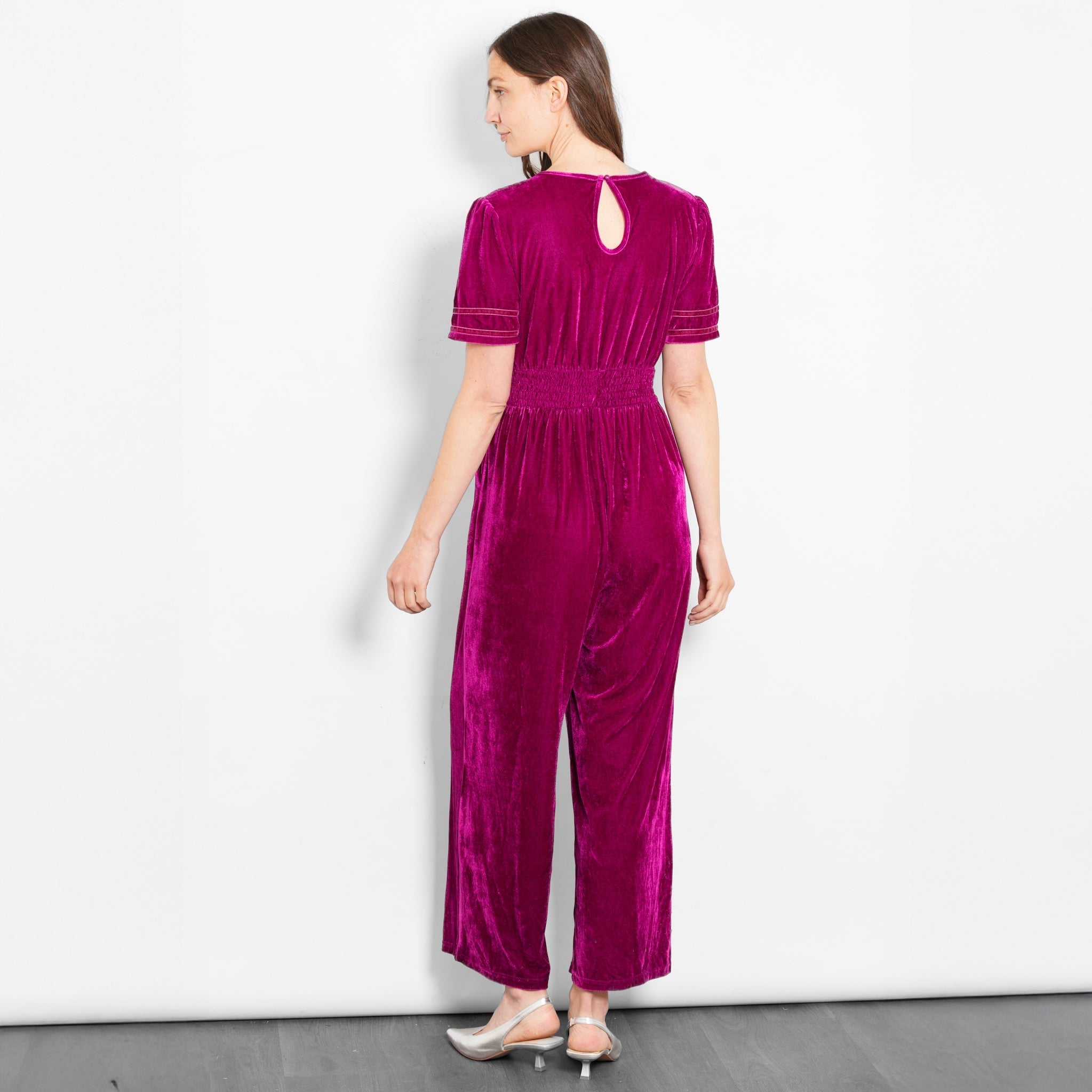lydia-v-neck-jumpsuit-berry-velvet-model-rear-view-button-fastening