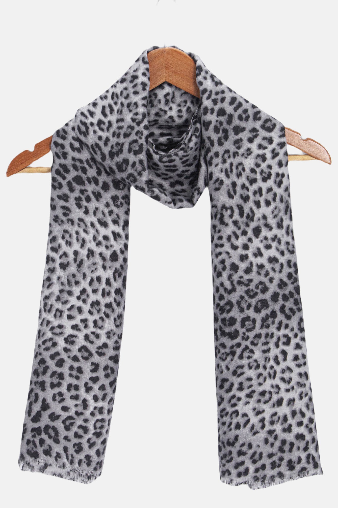 miley-blue-leopard-lightweight-scarf-draped-on-coat-hanger