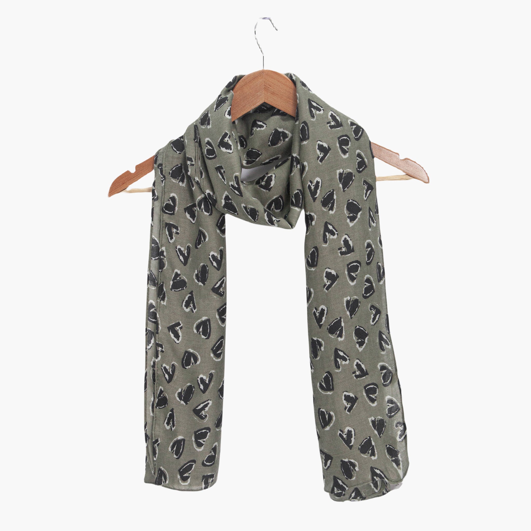 kara-khaki-black-hearts-lightweight-scarf-draped-on-coat-hanger