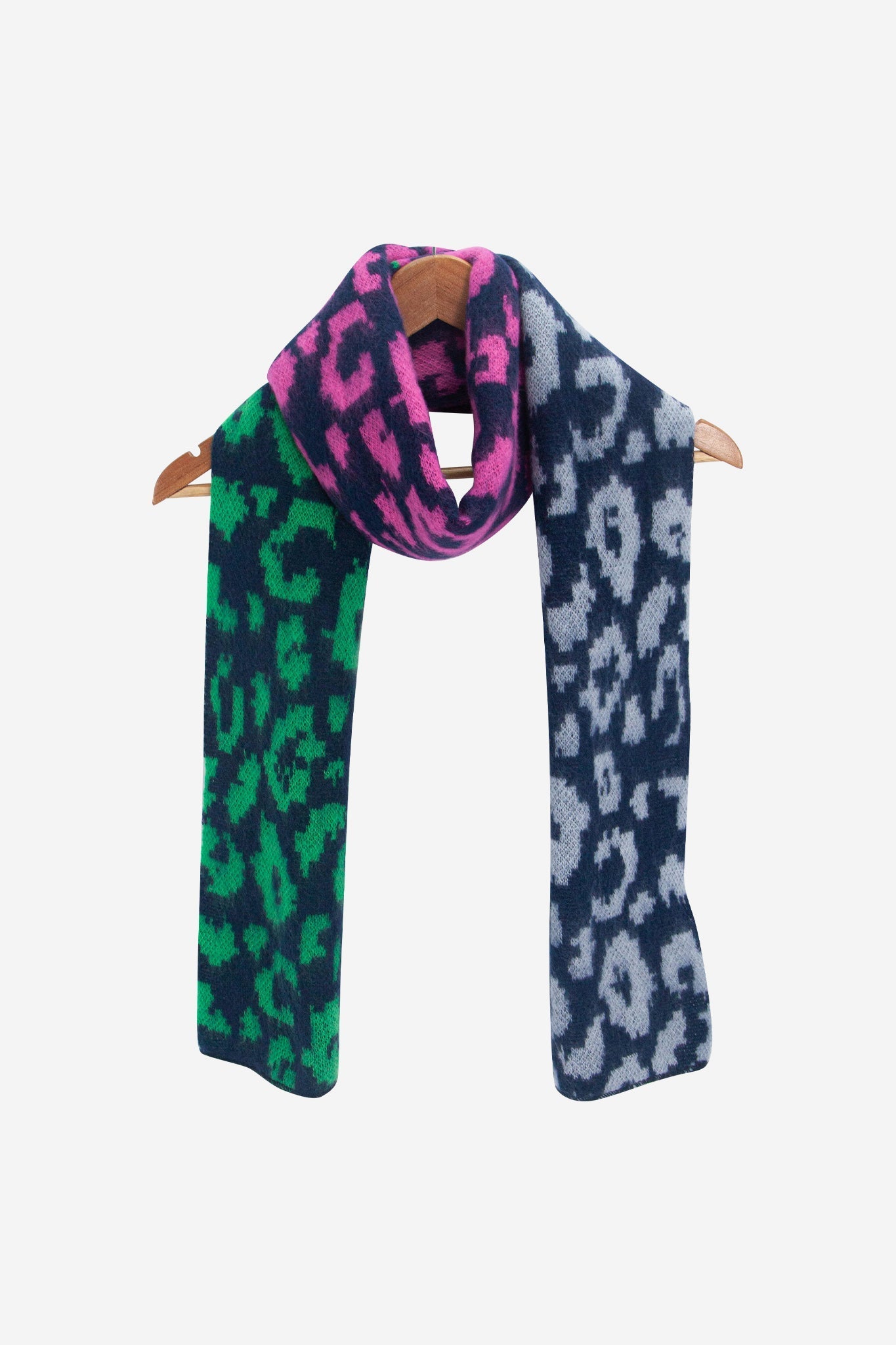 kyra-navy-blue-leopard-heavyweight-scarf-draped-on-coat-hanger