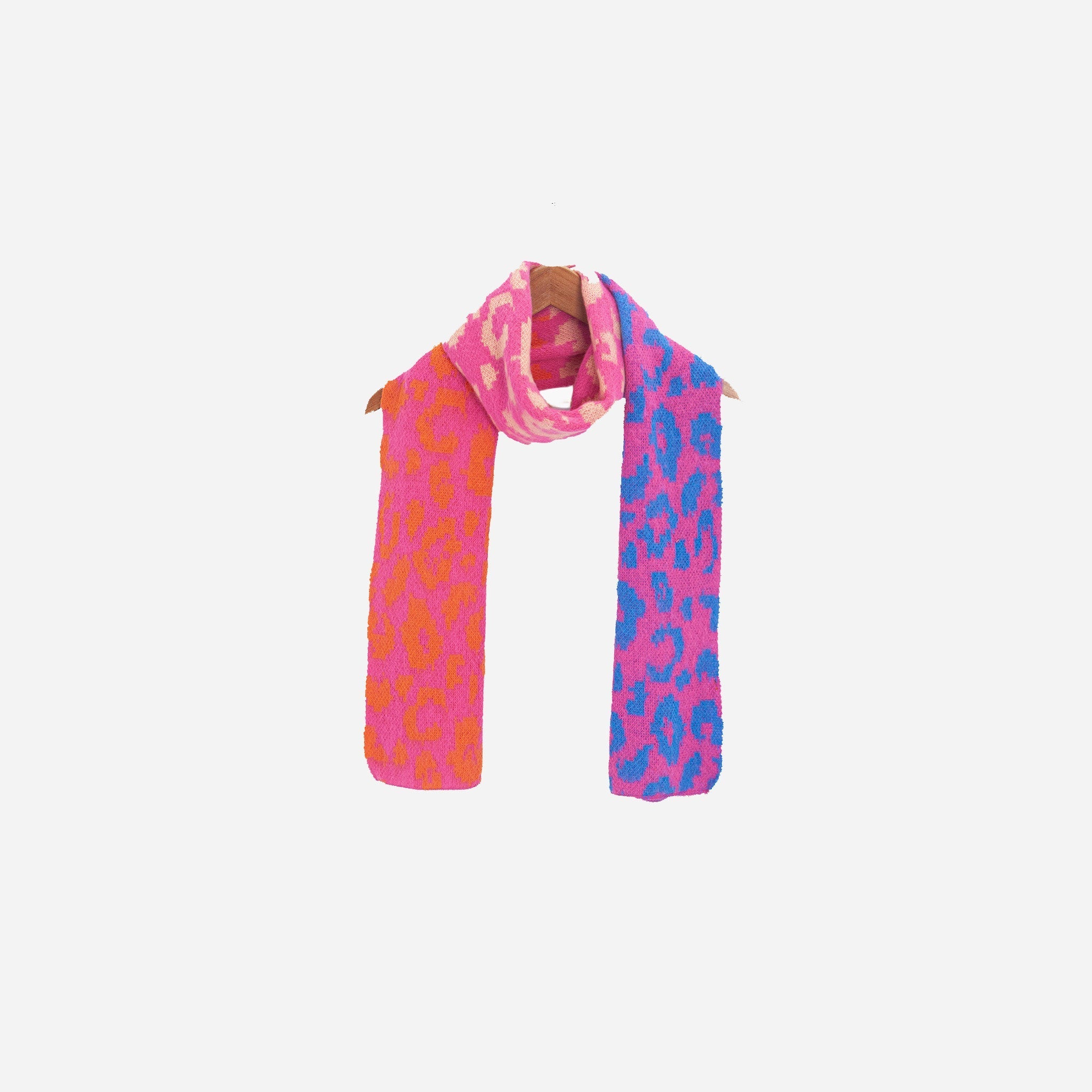 kyra-pink-leopard-heavyweight-scarf-draped-on-coat-hanger