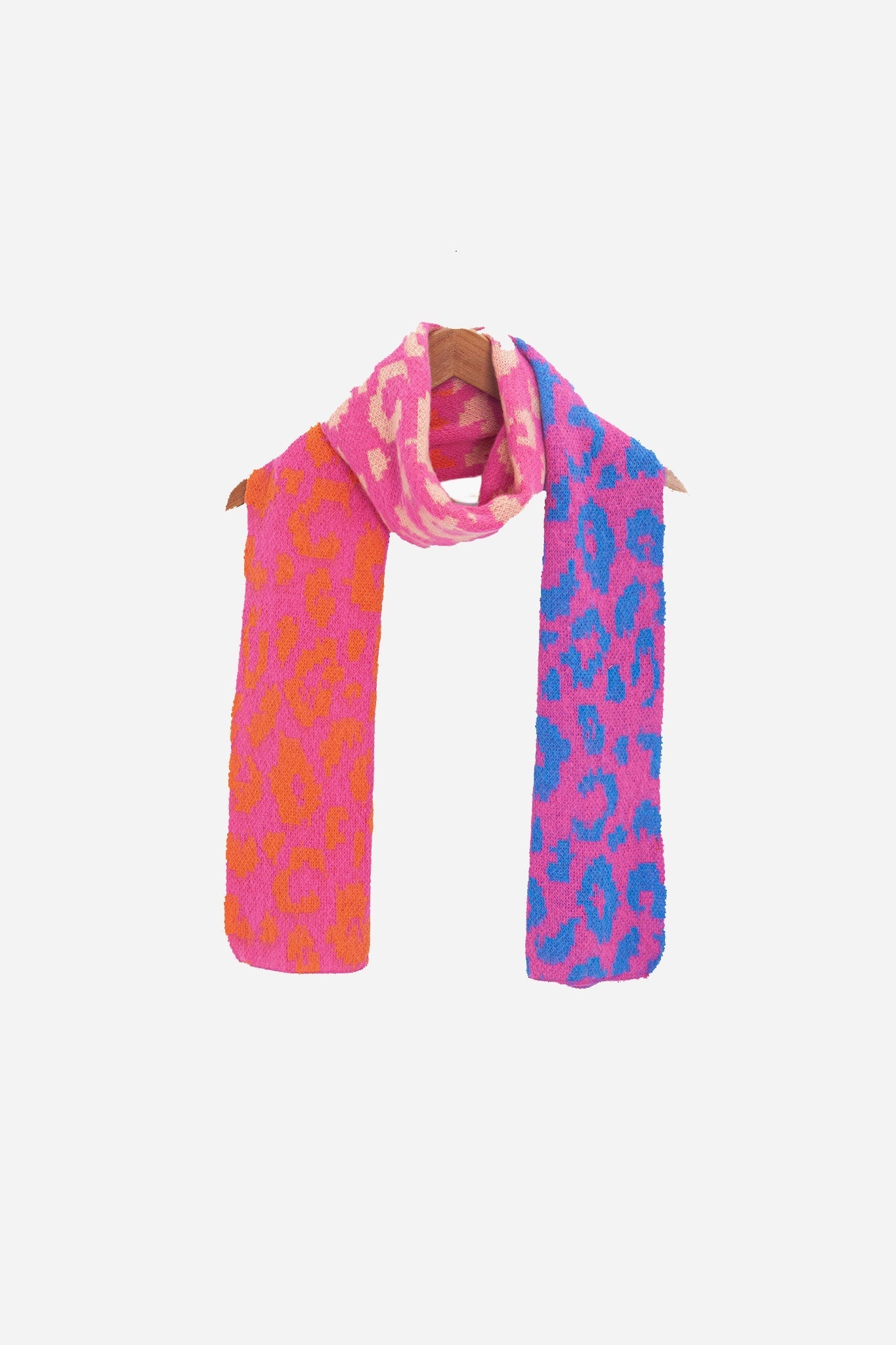 kyra-pink-leopard-heavyweight-scarf-draped-on-coat-hanger