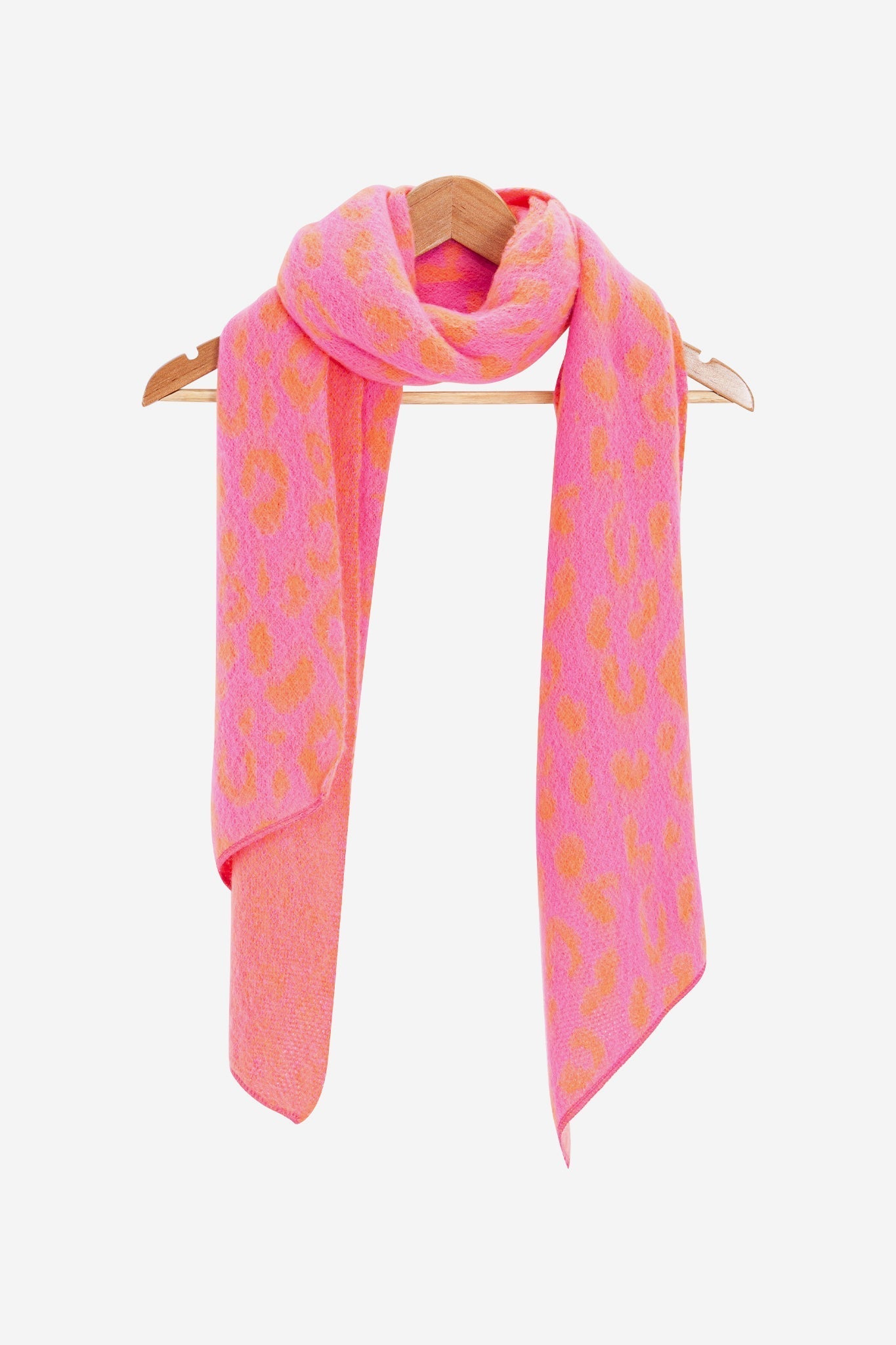 nico-pink-orange-leopard-heavyweight-scarf-draped-on-coat-hanger