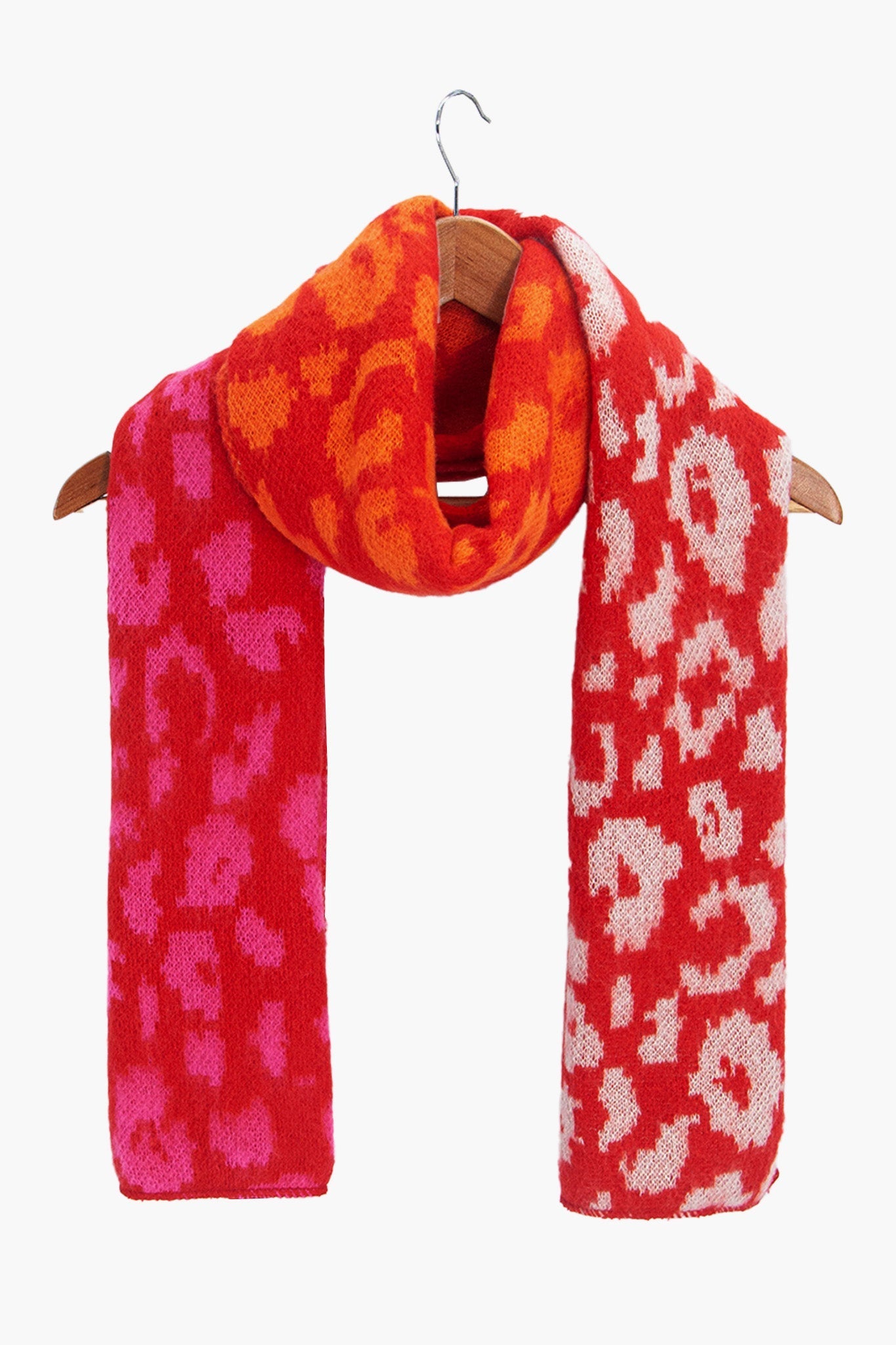 kyra-red-leopard-heavyweight-scarf-draped-on-coat-hanger