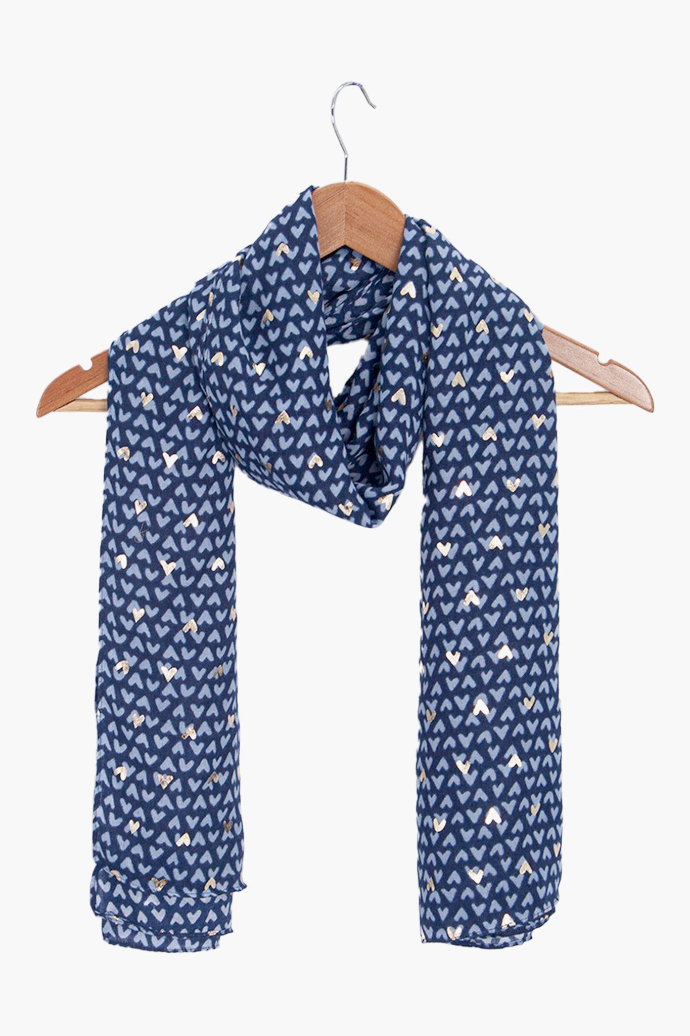 rainie-blue-metallic-hearts-lightweight-scarf-draped-on-coat-hanger
